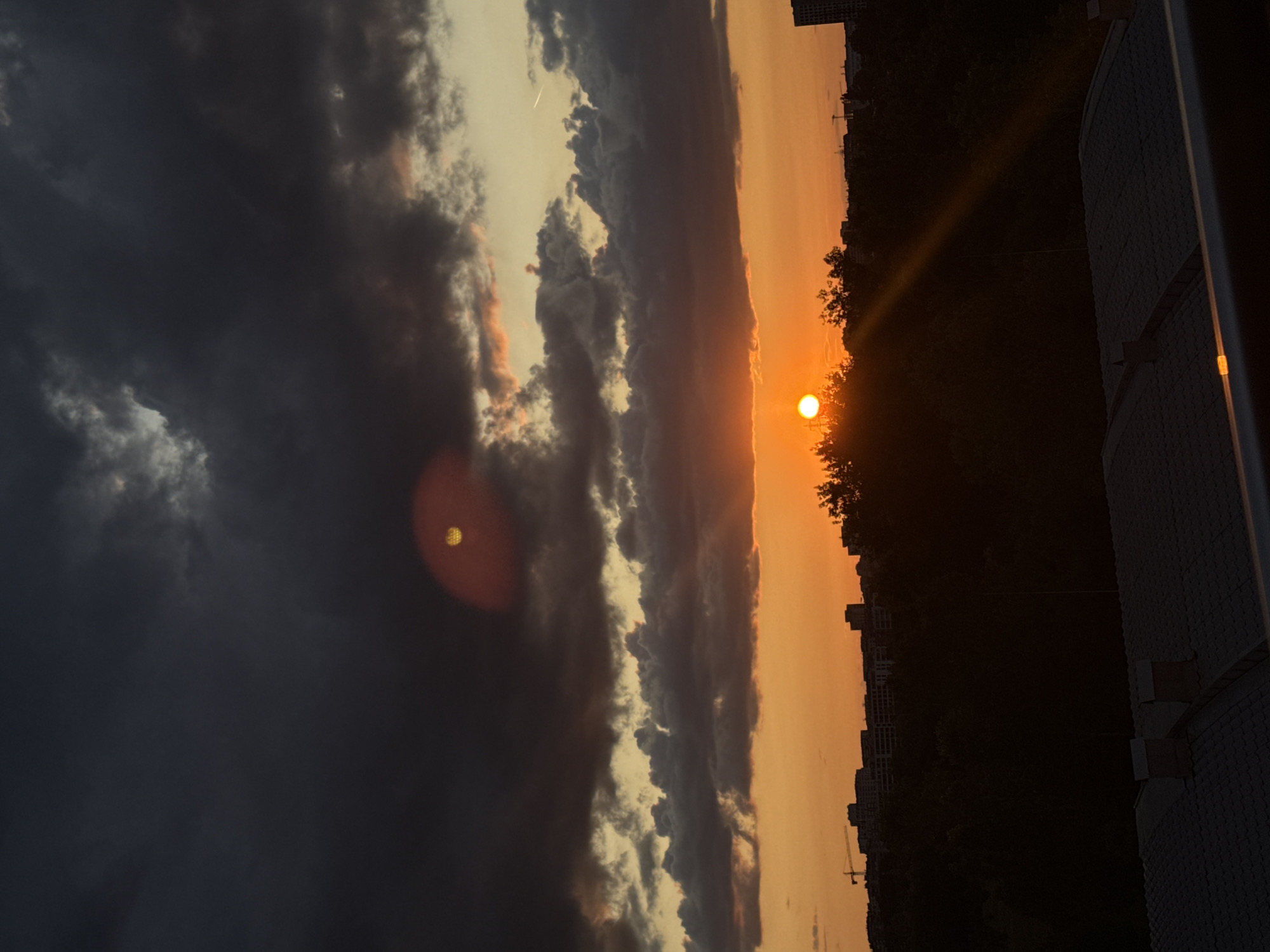 Stormy sunset over Sofia with a helicopter in flight