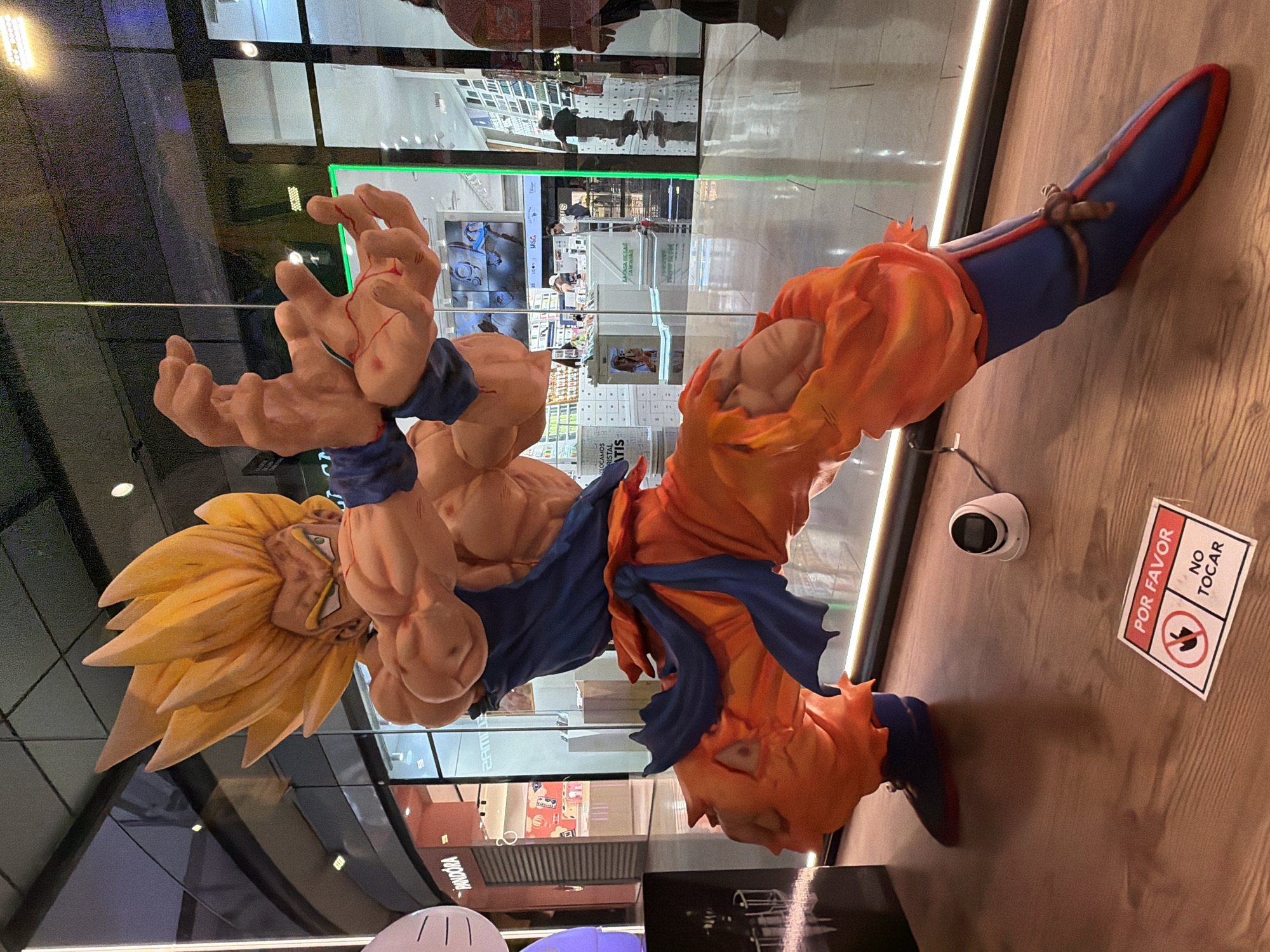 Barcelona plaza construction and anime statue witnessed during midday