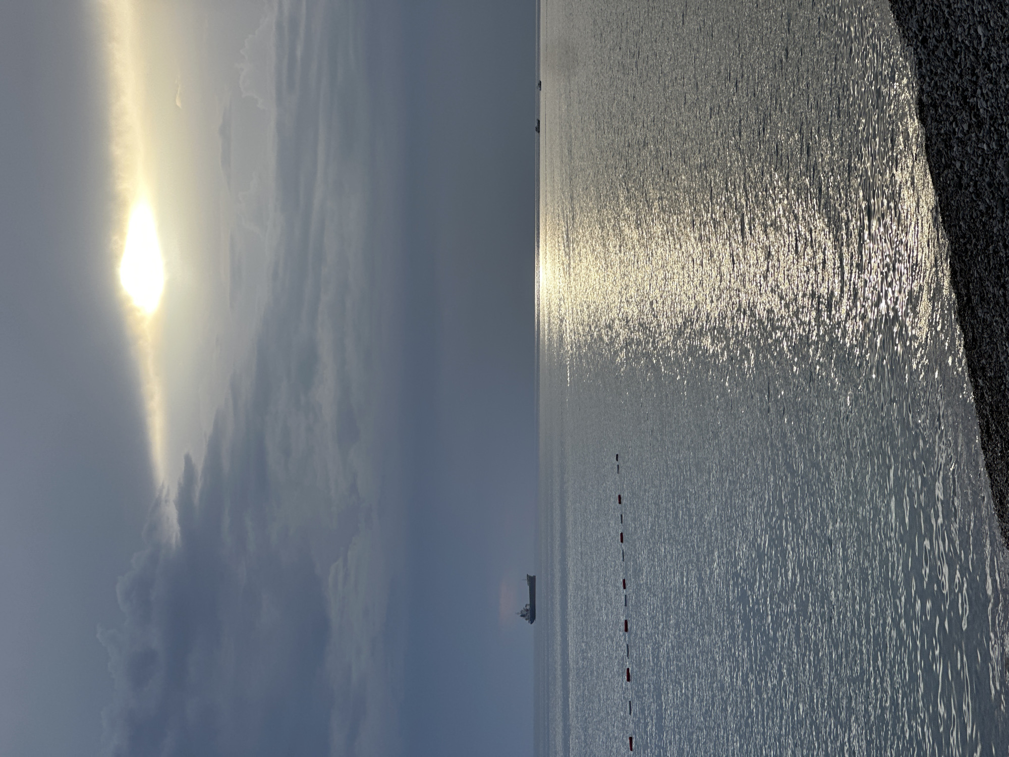 Sunlight breaks through clouds over Adriatic Sea at Šušanj