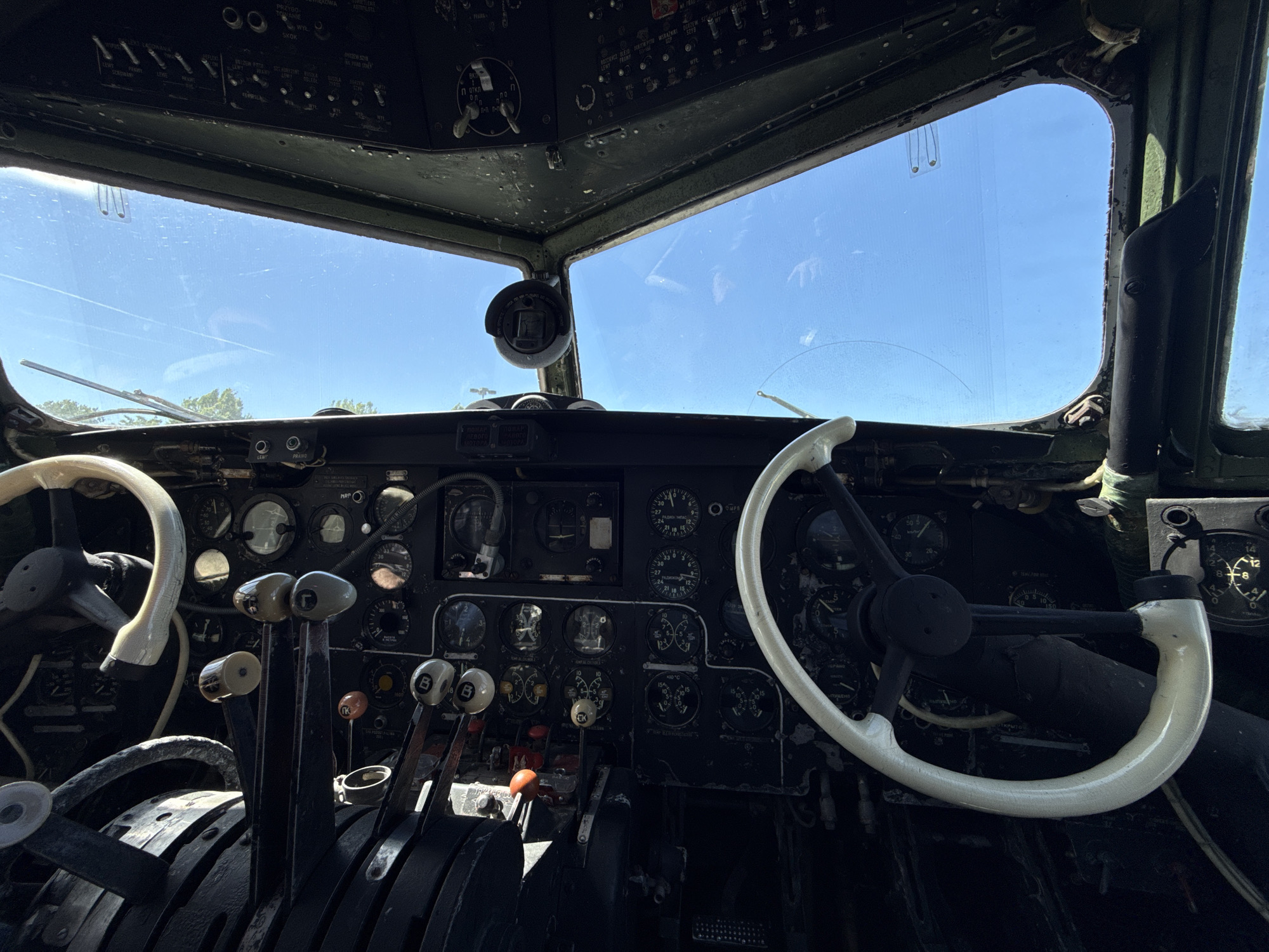 Person observed in vintage aircraft cockpit during afternoon hours