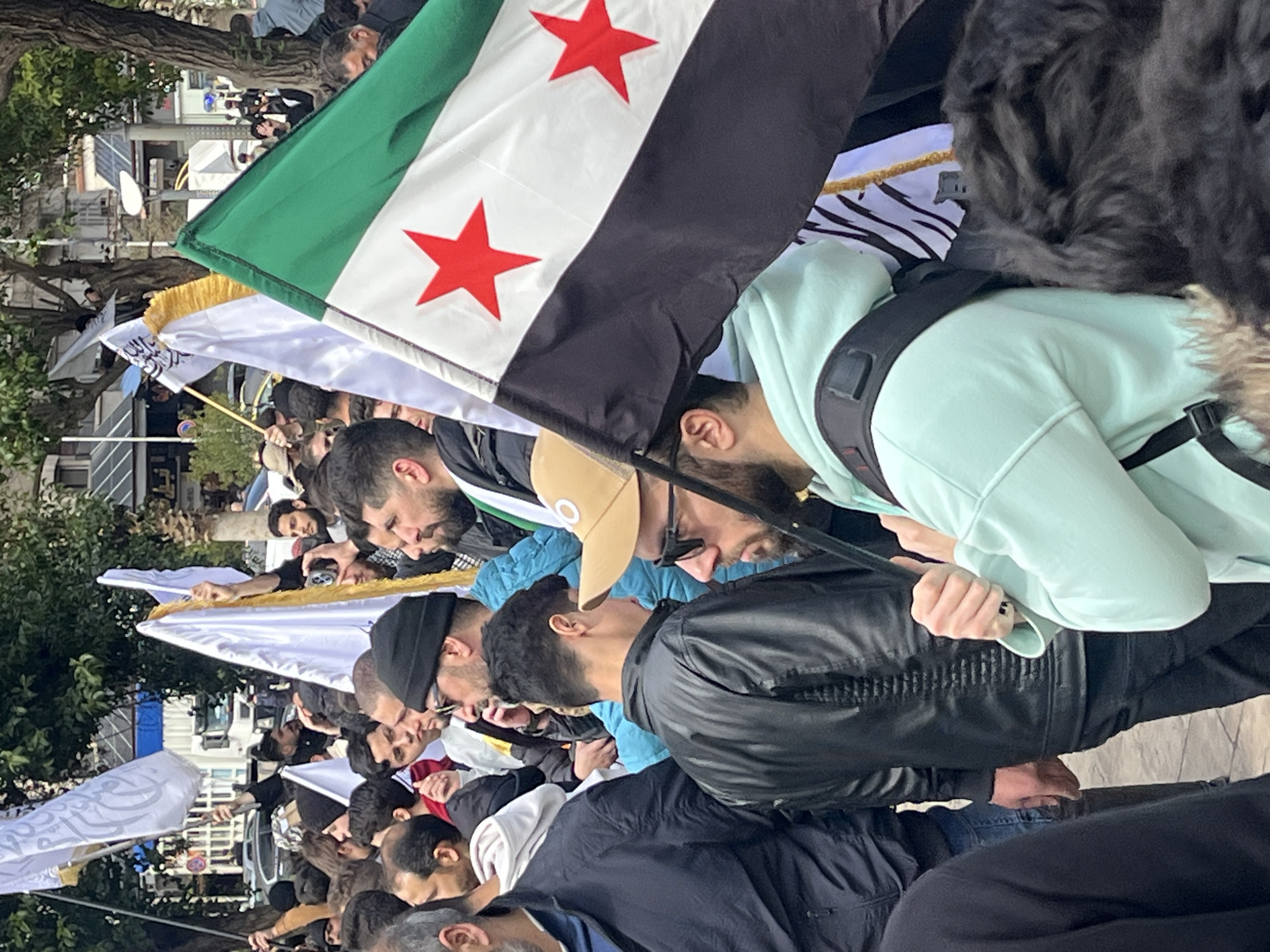 Large crowd demonstration with flags in Damascus, Syria