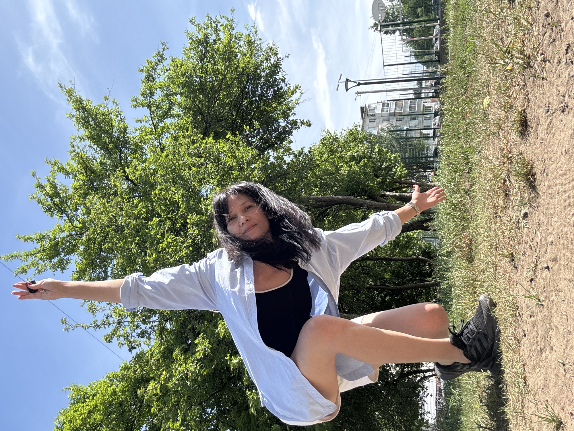 Woman poses for outdoor photo session in urban park