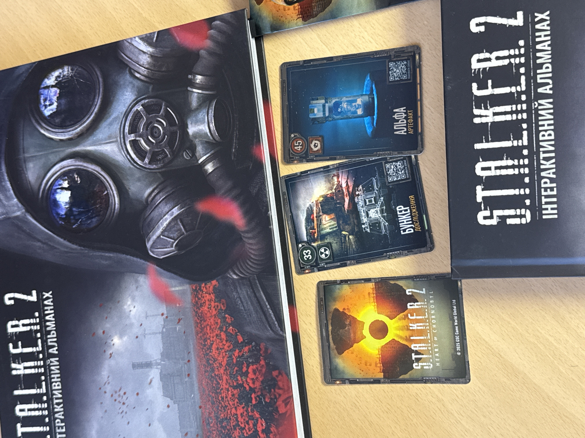 Kyiv resident unboxes STALKER 2 collector merchandise amid spring blooms