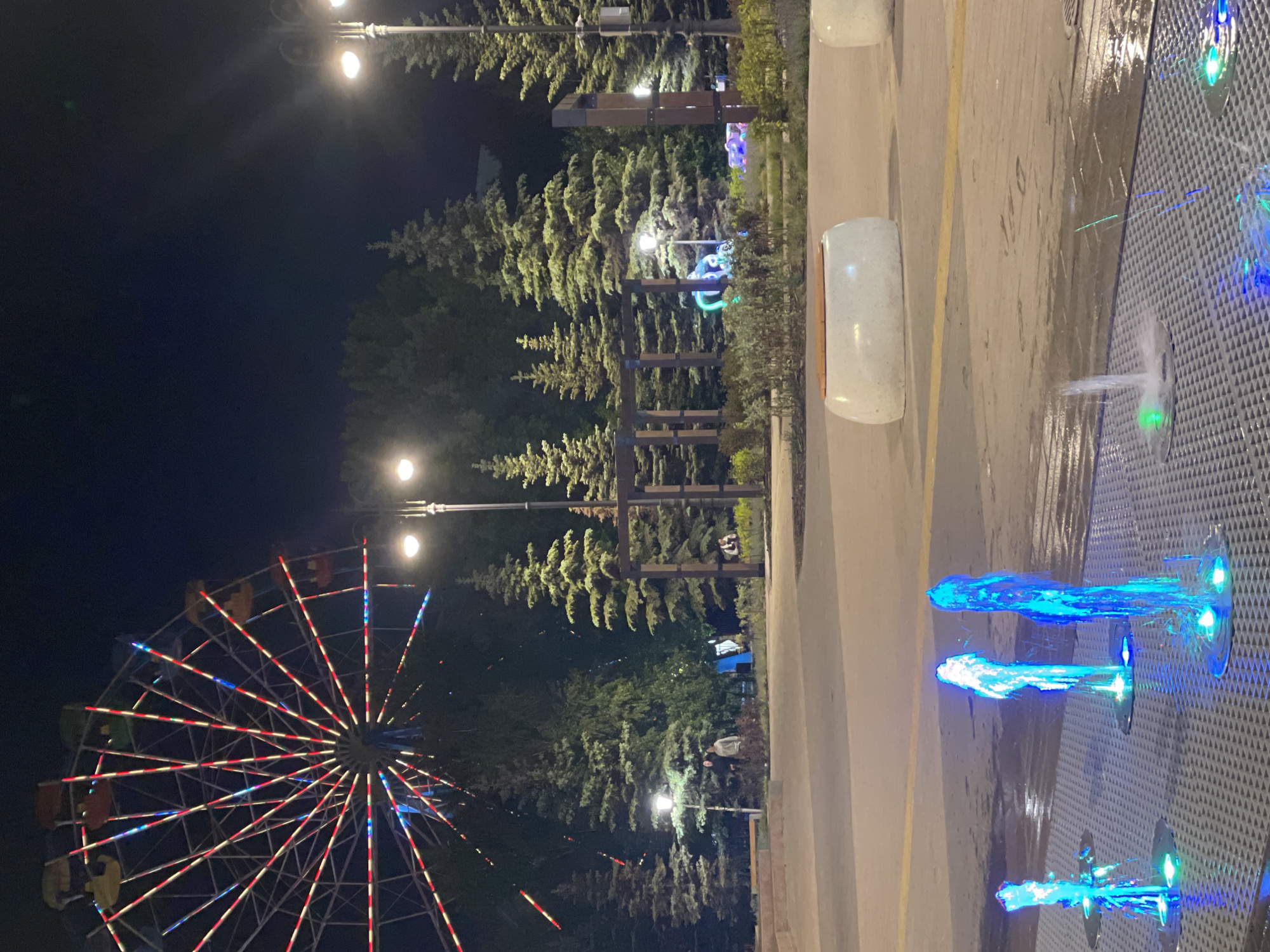 Evening cyclist captures illuminated attractions in Kokshetau, Kazakhstan