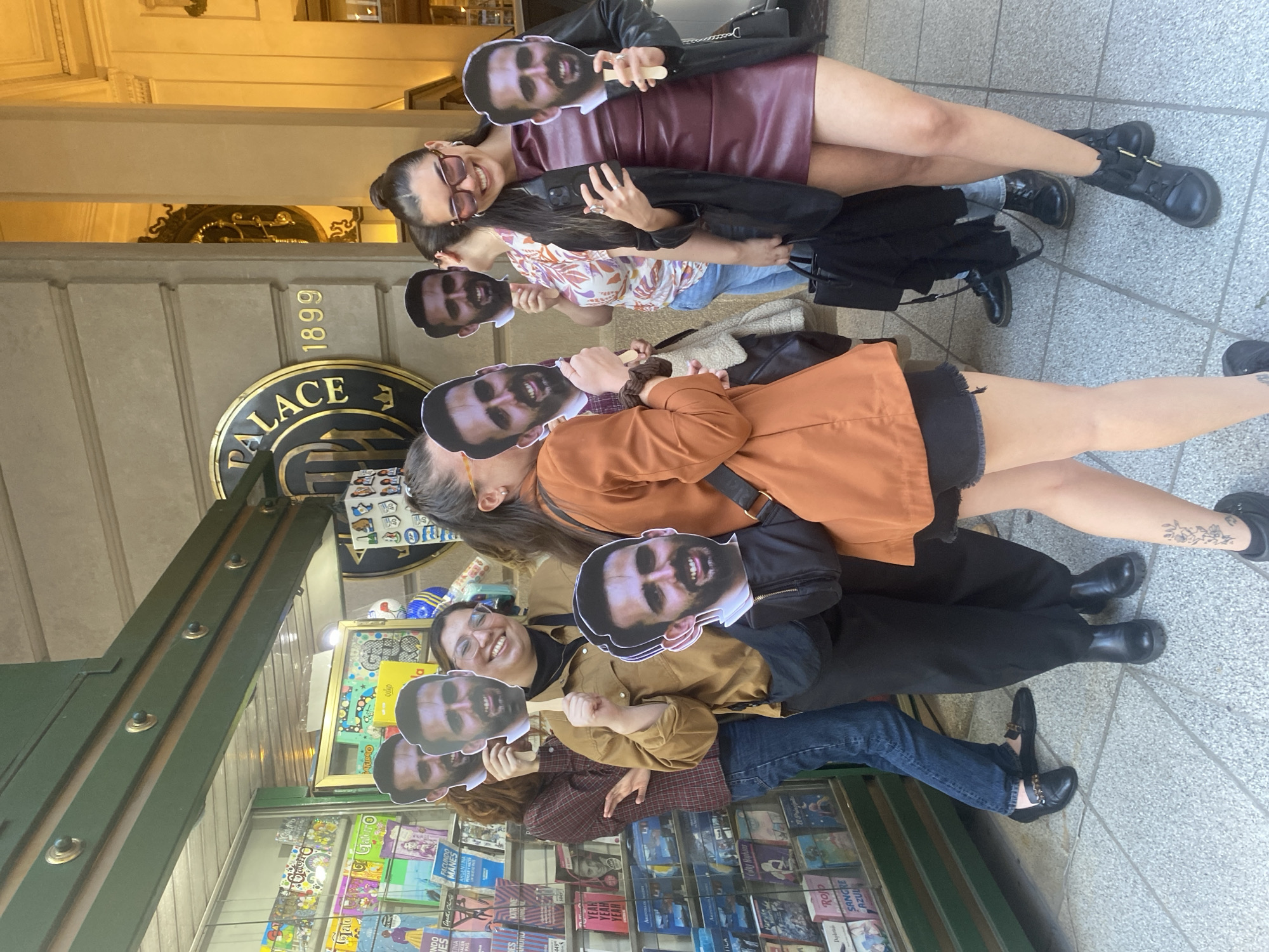Group gathers with bearded man masks near Buenos Aires newsstand