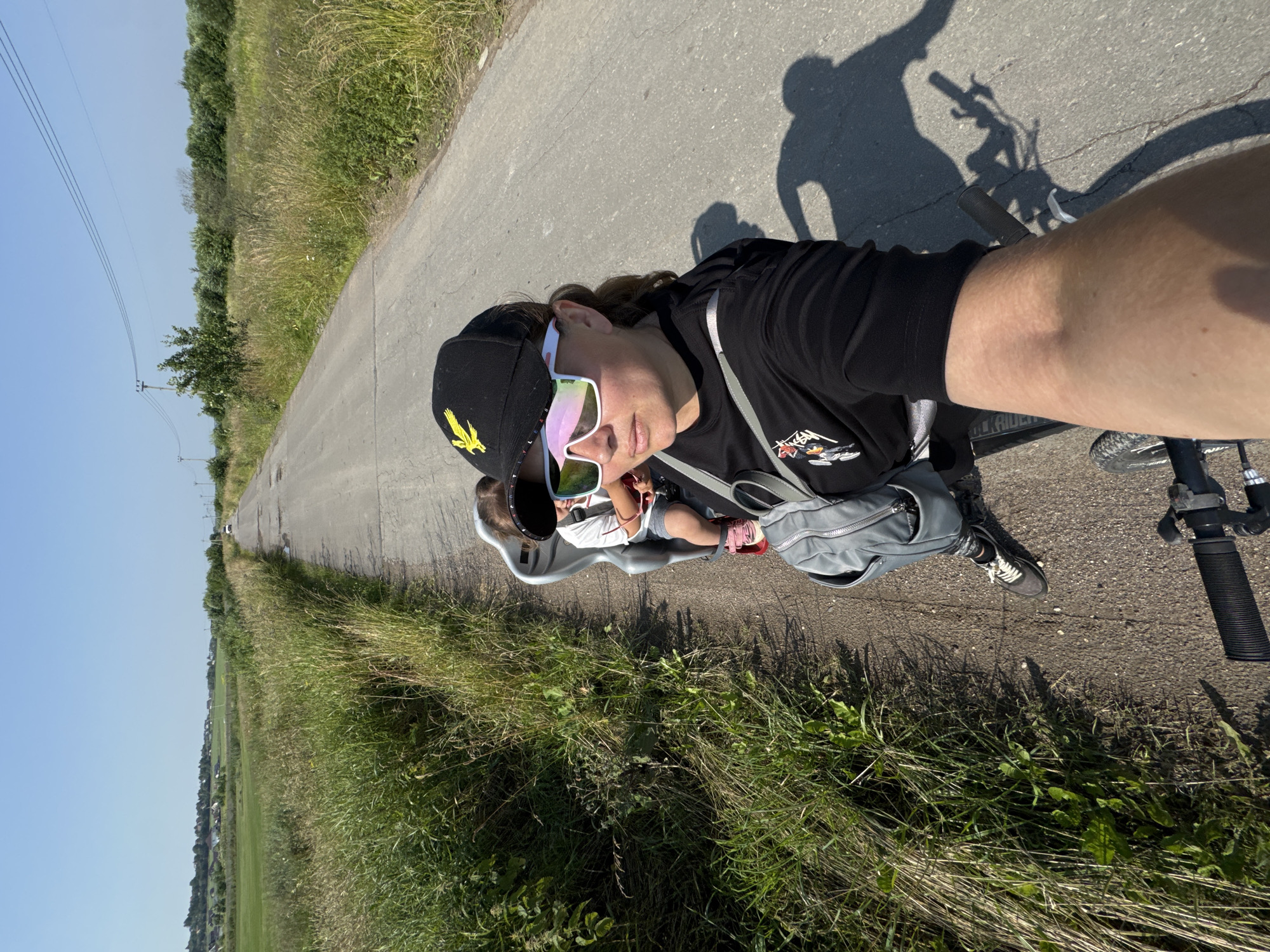 Morning bike ride in Kempelevo with a tiny sunglass-wearing passenger
