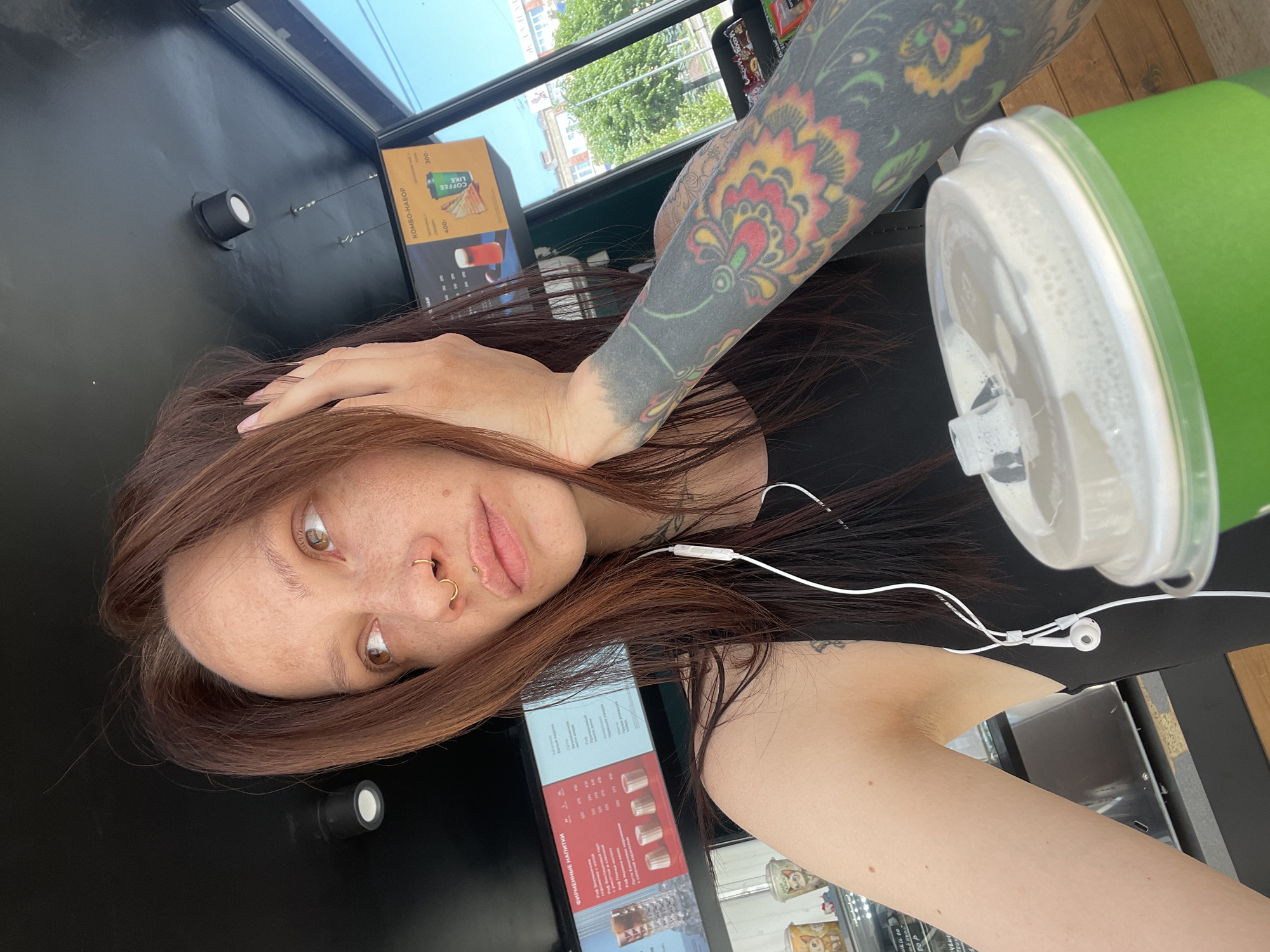 Tattooed cafe patron spotted with earphones in Izhevsk