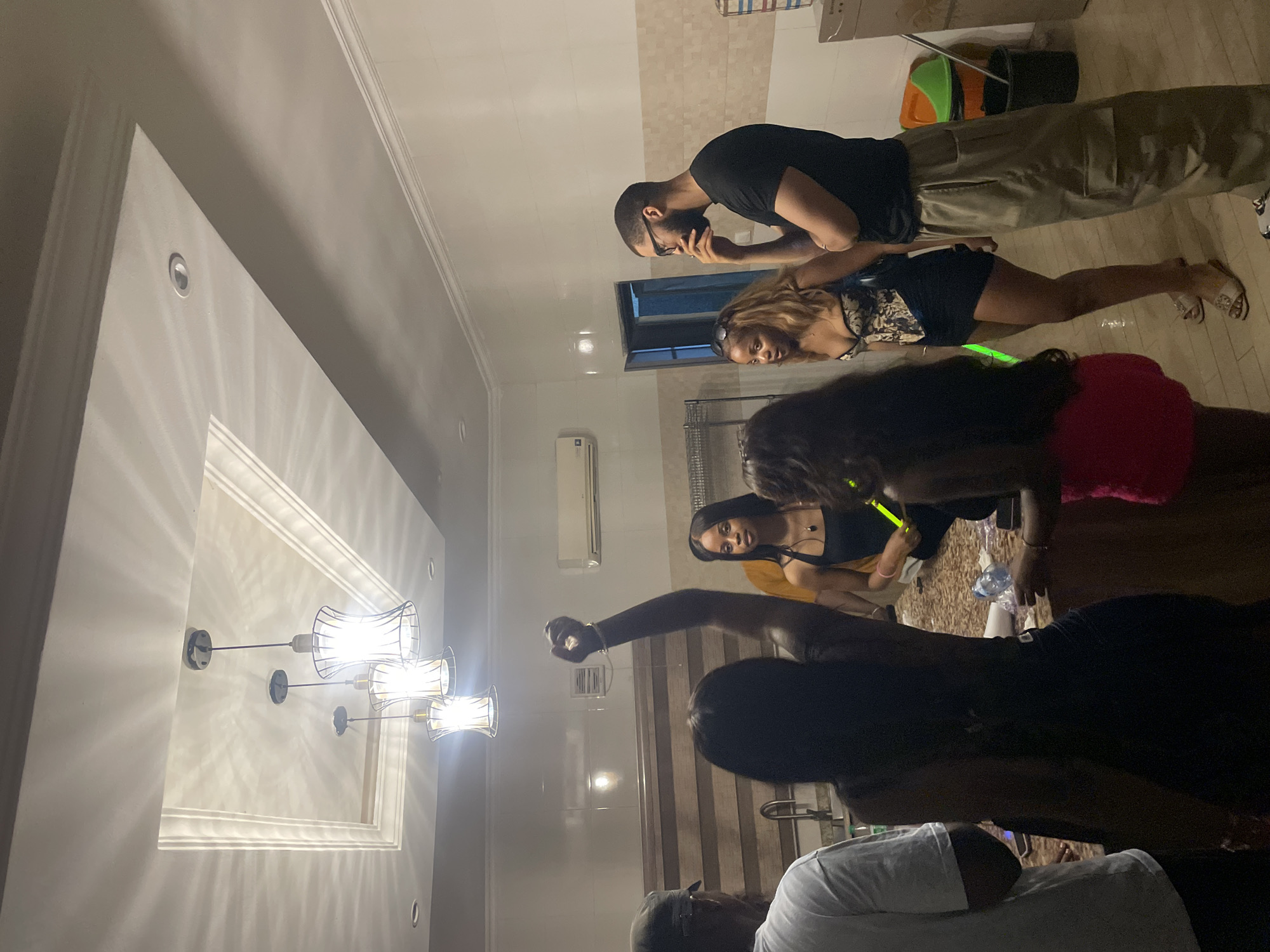 Indoor hangout in Jiru — kitchen socializing and pool table games