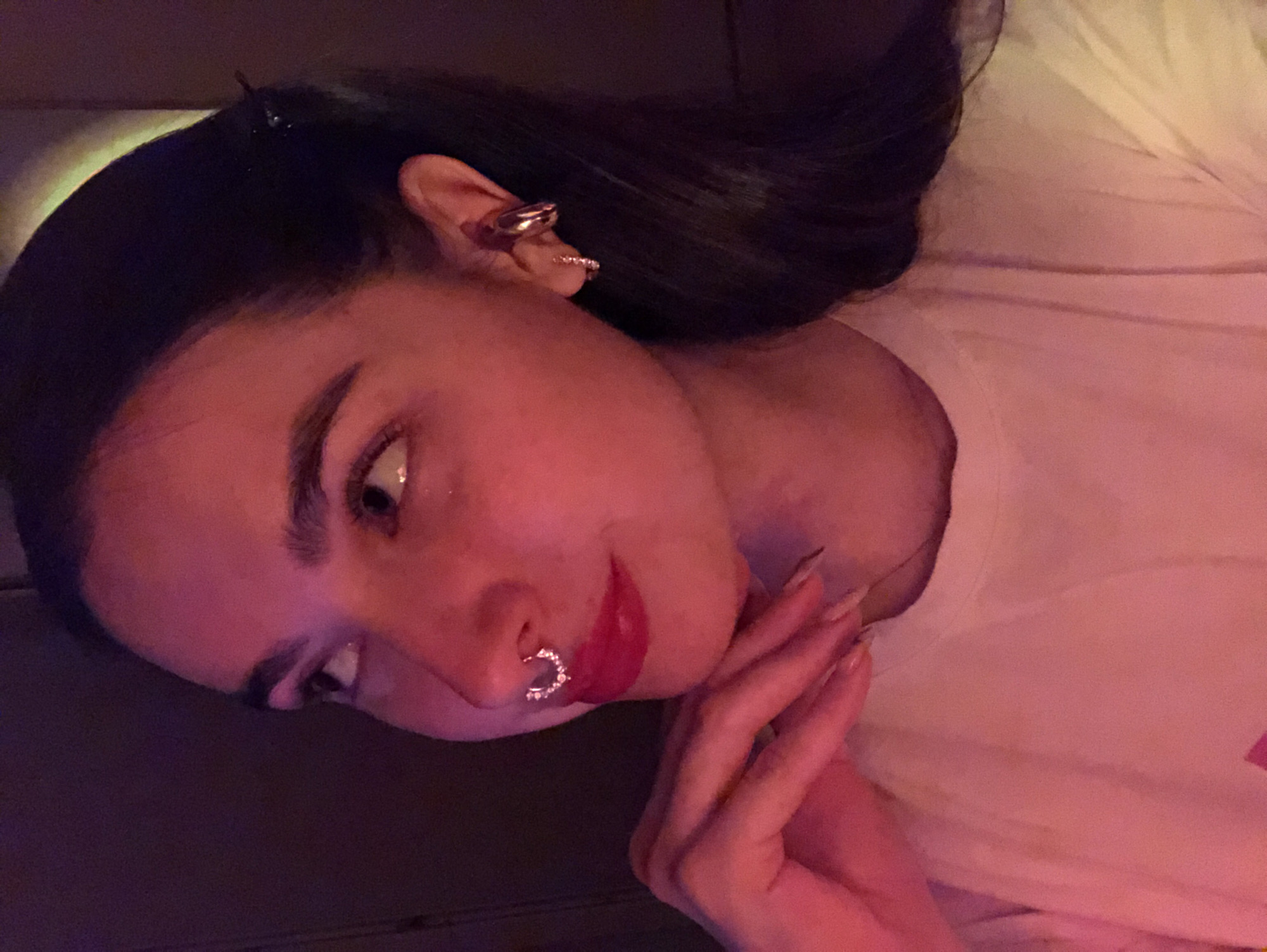 Woman with piercings observed indoors in Noviy, Russia