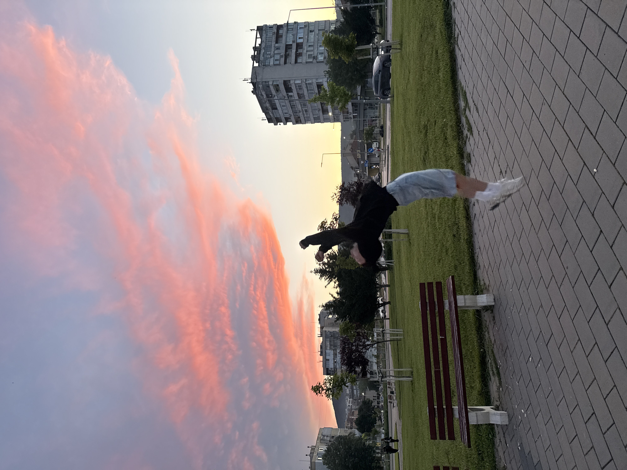 Acrobat performs sunset backflips in Shumen, Bulgaria park
