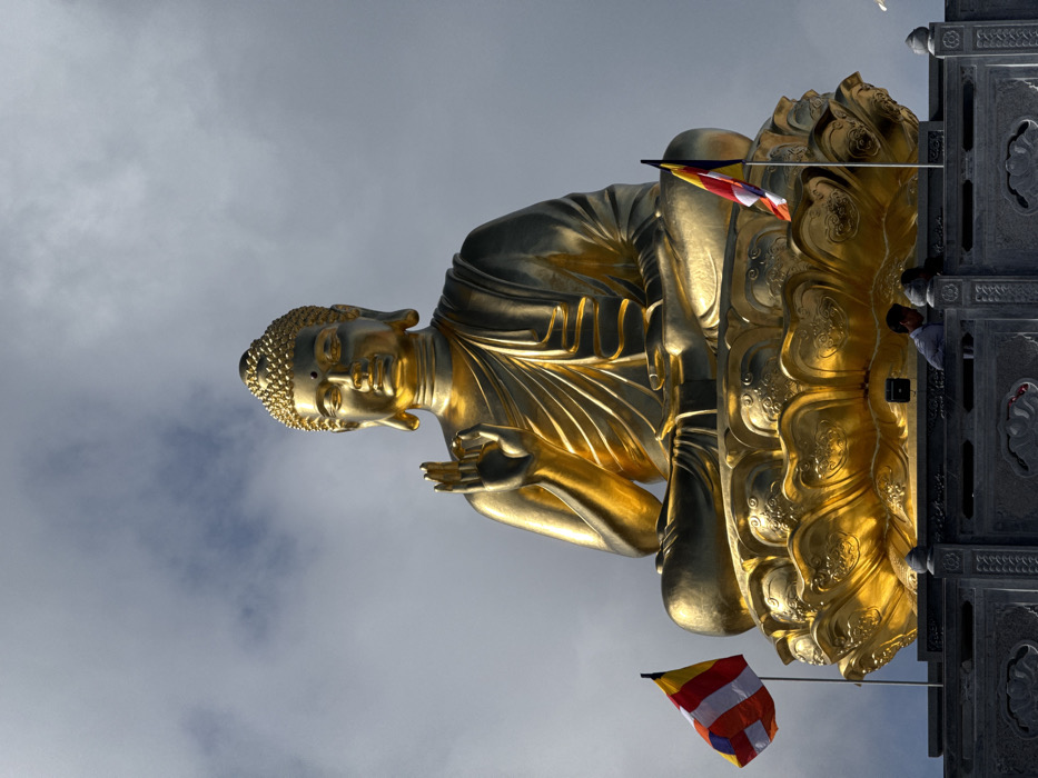 Tourists visit golden Buddha temple complex in Vietnam