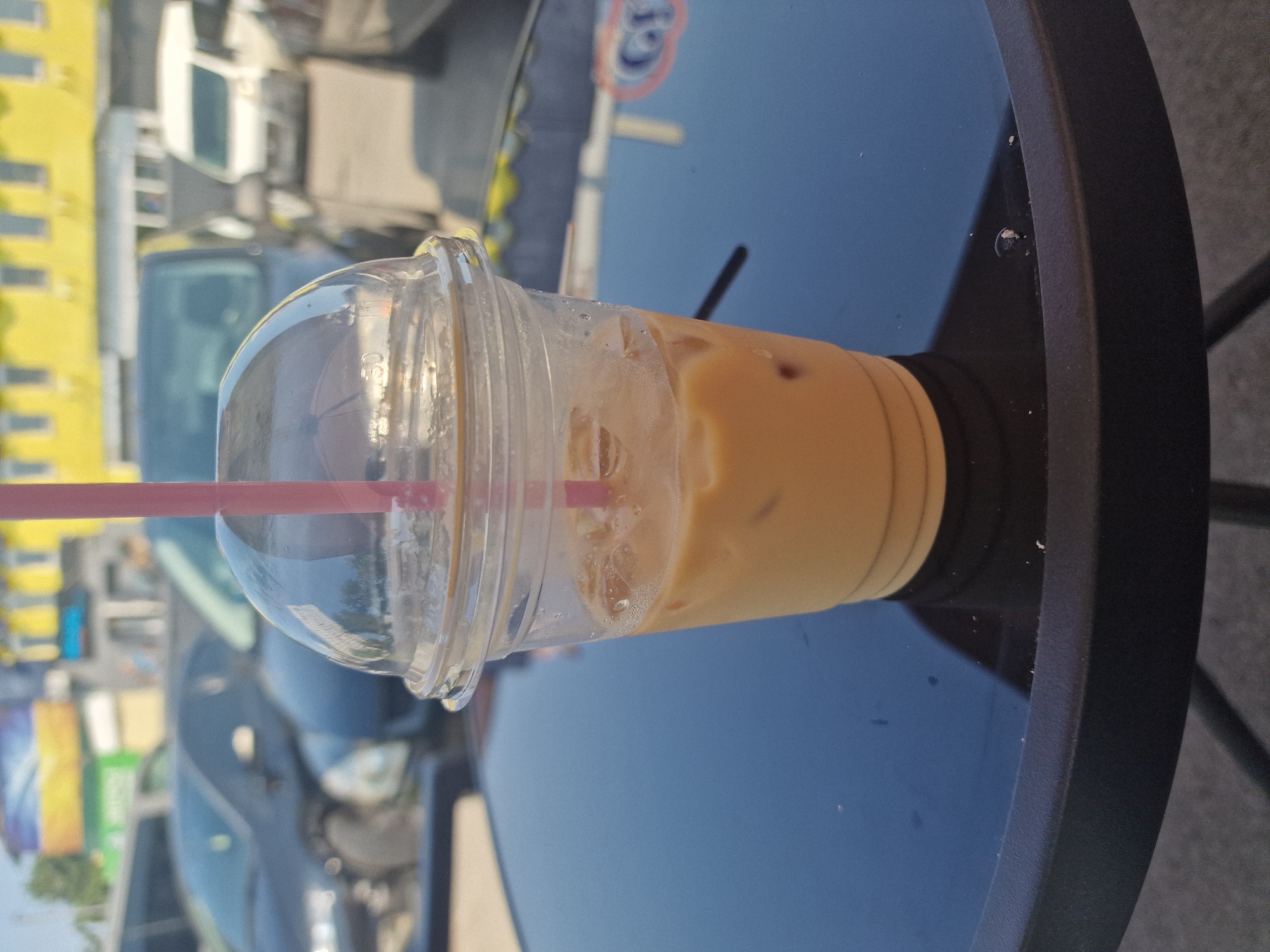 Iced coffee, a lounging cat, and morning cafe selfies