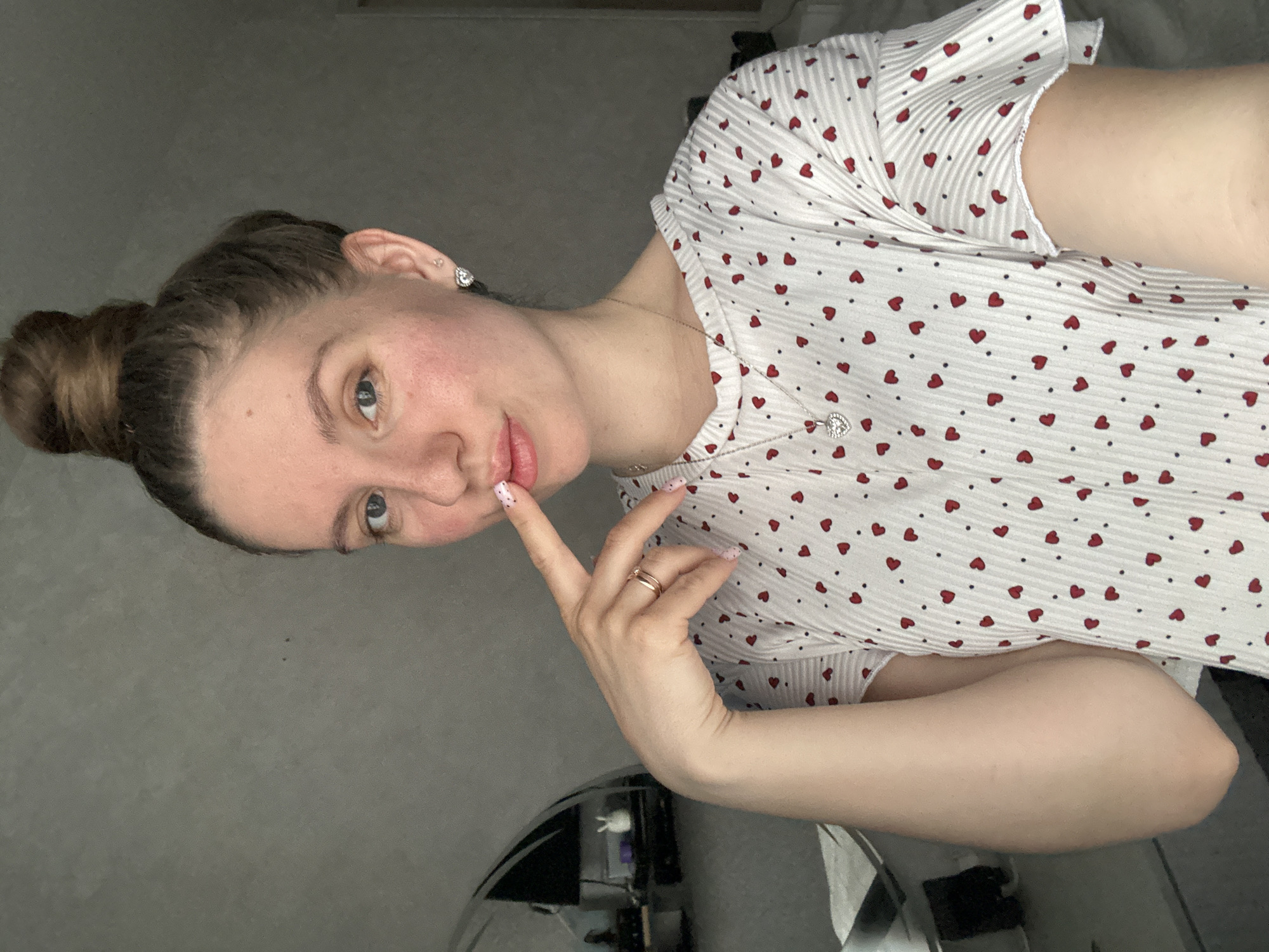 Woman documents skincare routine with electronic devices in Klin