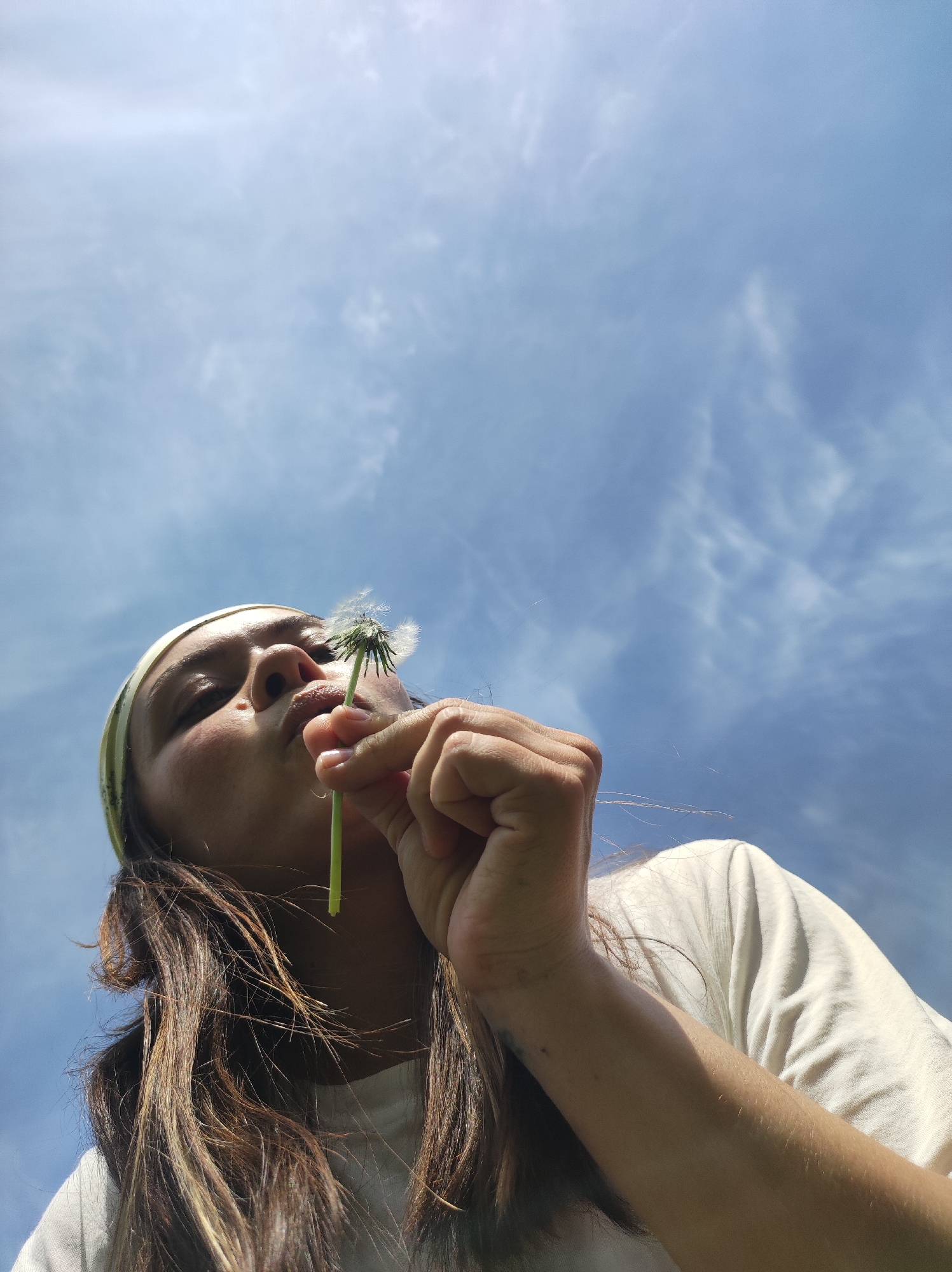 Woman Makes Dandelion Wishes in Russian Village Morning