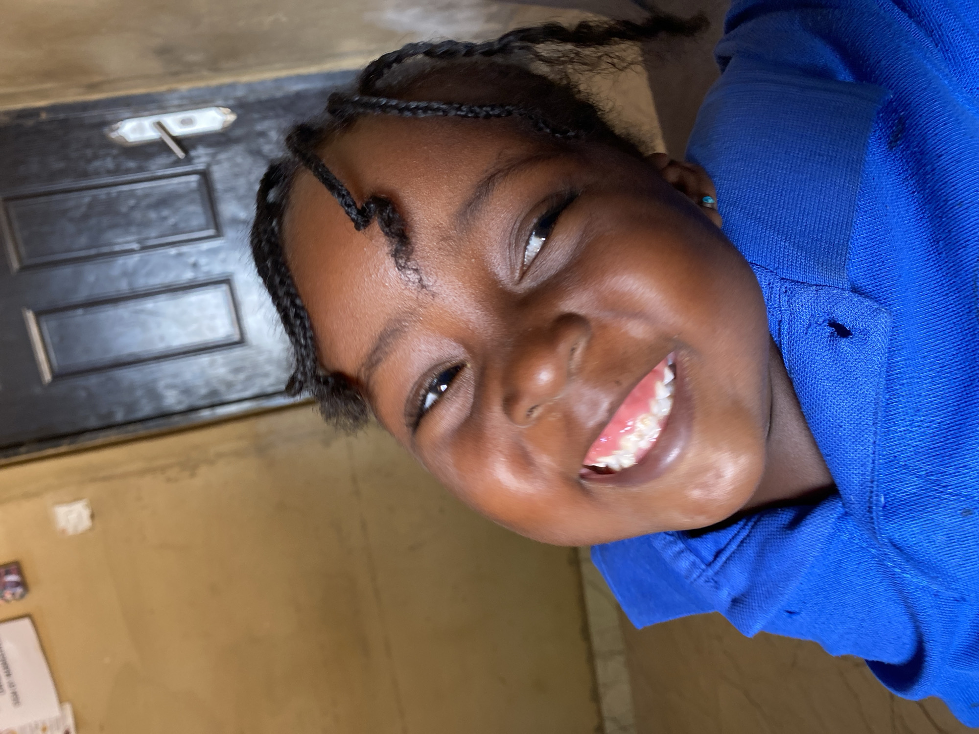 Young girl poses for cheerful portraits in Kuru Dungus