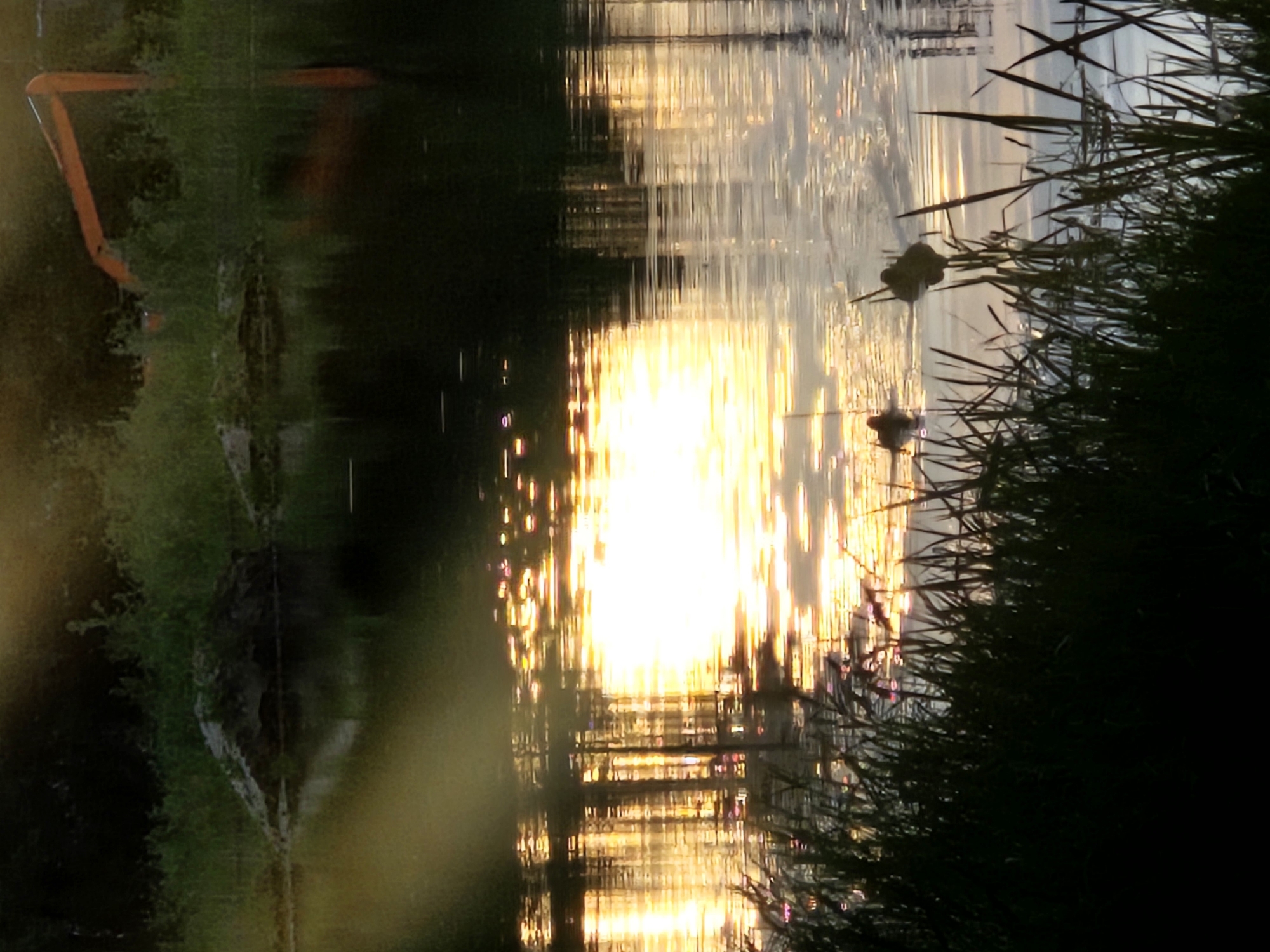 Sunset observed over water in Bykovo, Russia