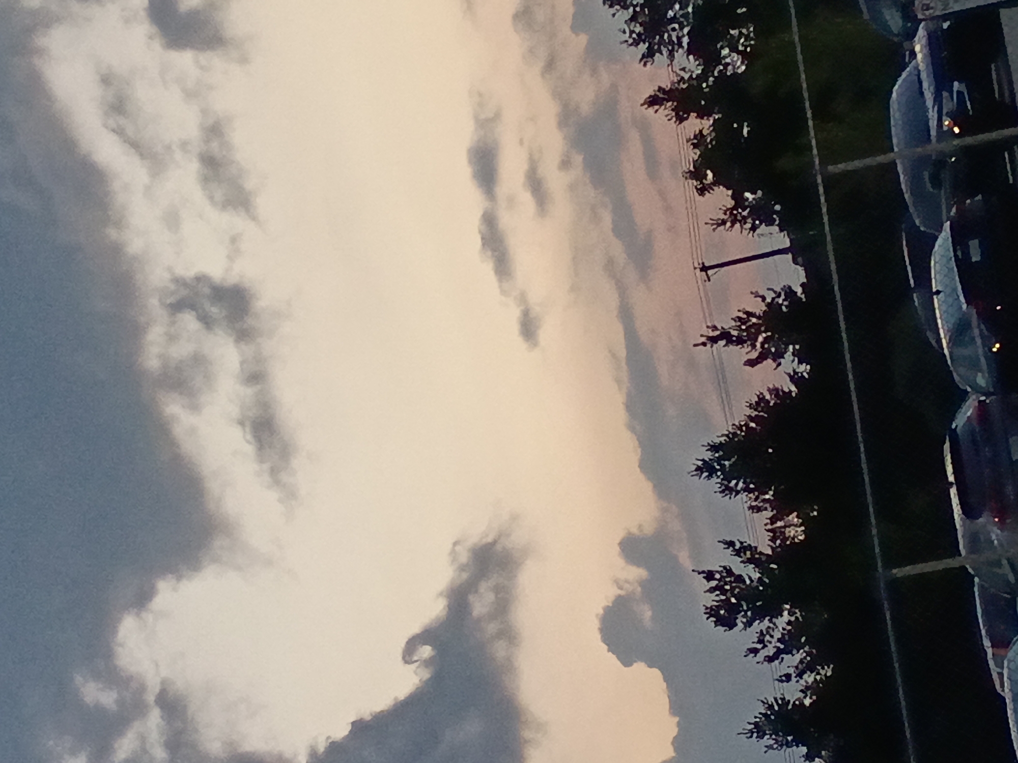Dusk settles over a fenced parking lot in Lexington
