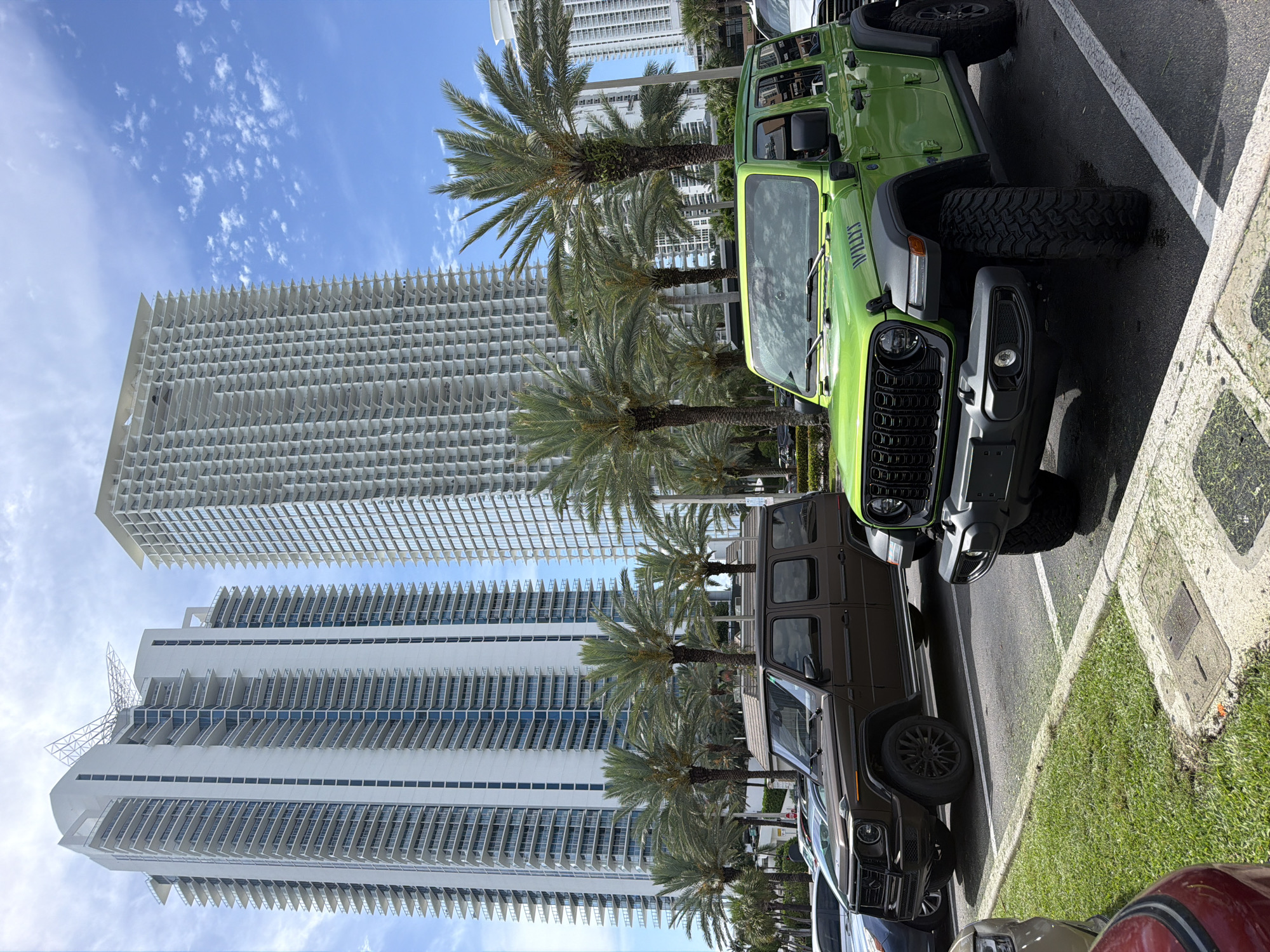Bold green Jeep and G-Class parked in Sunny Isles Beach lot