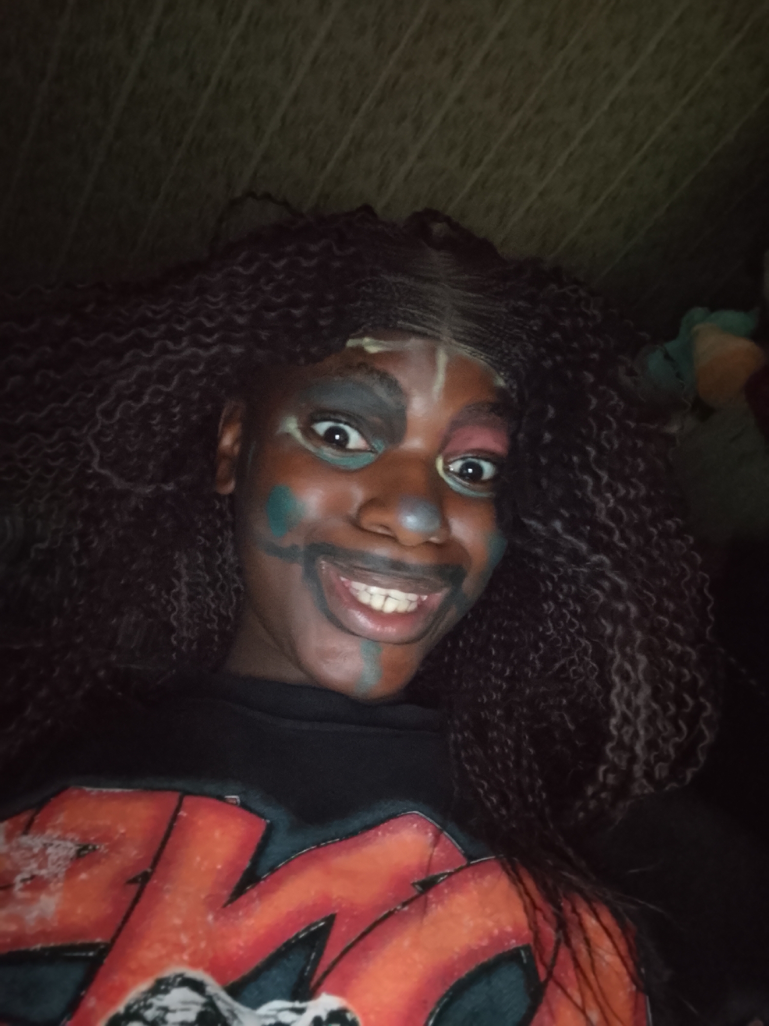 Face-painted individuals photographed in artistic portraits