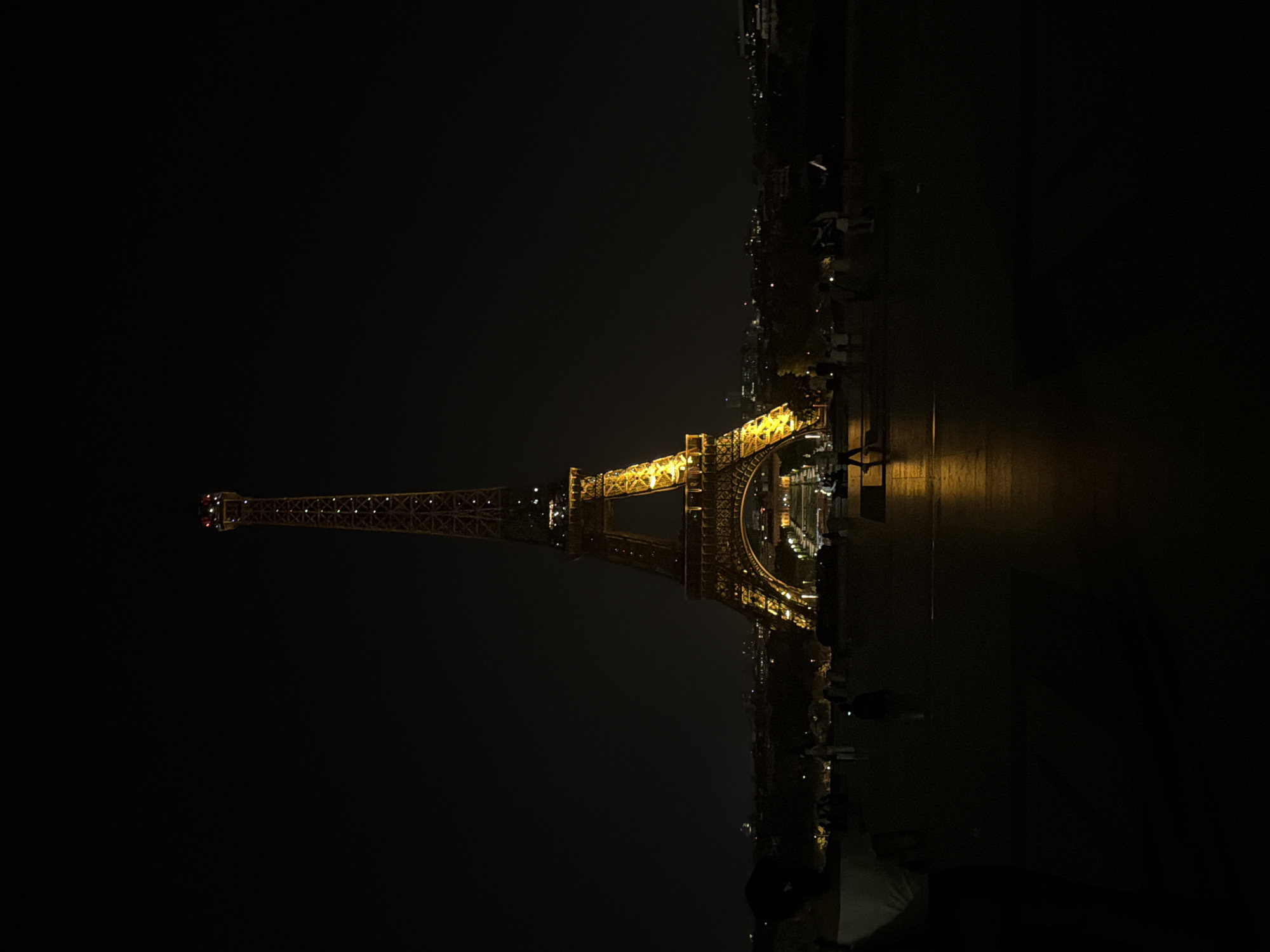 Eiffel Tower illuminated at night in Paris