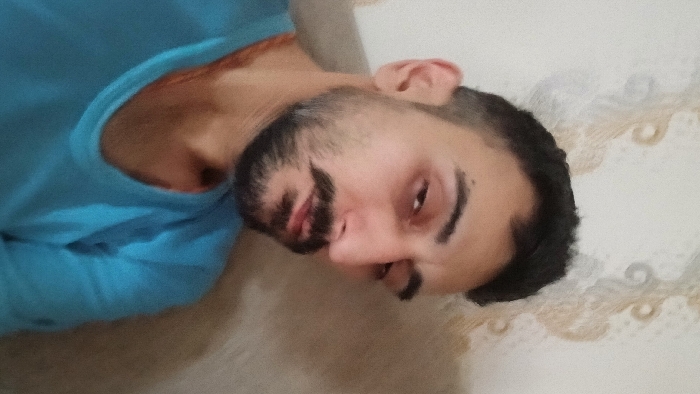 Man photographed lying down in Parand, Iran