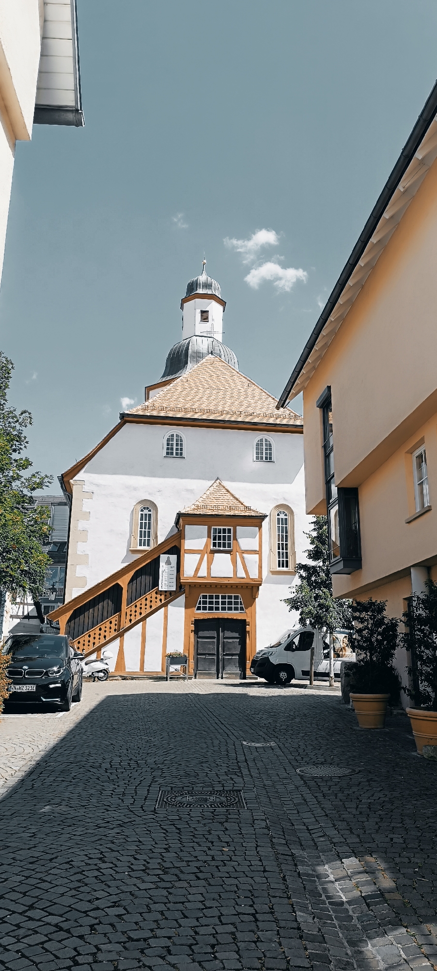 Cobblestone streets and a domed church in a European old town