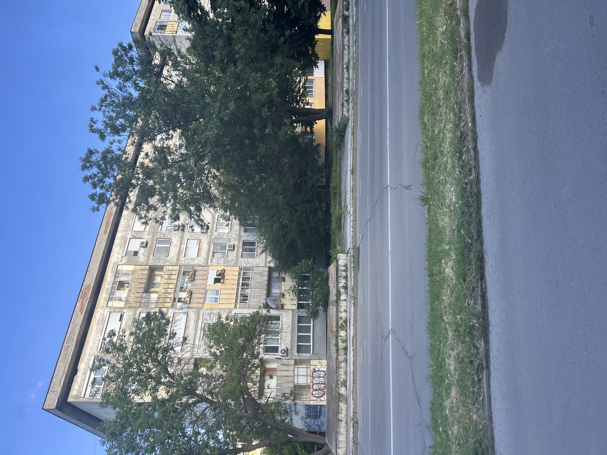 Worn apartment building with graffiti observed in Ruse, Bulgaria