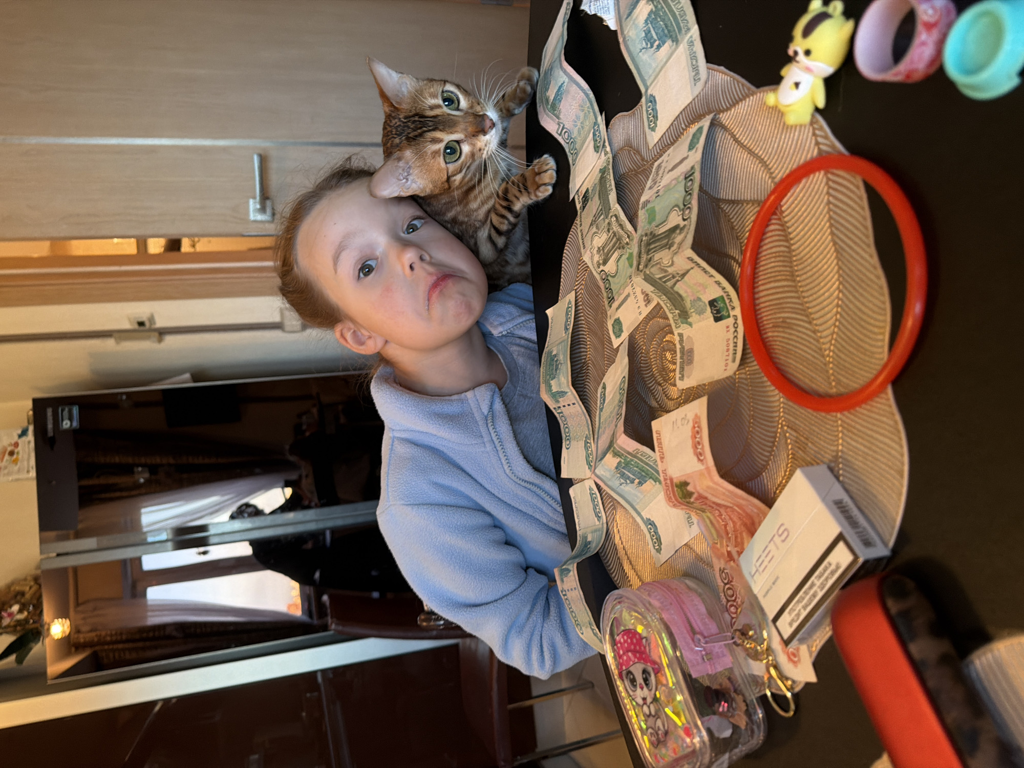Girl with cat in Saint Petersburg home