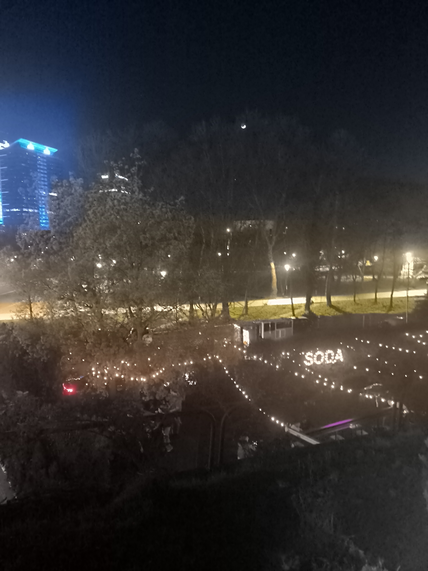Sofia nighttime scene captured with tourism display, classic car