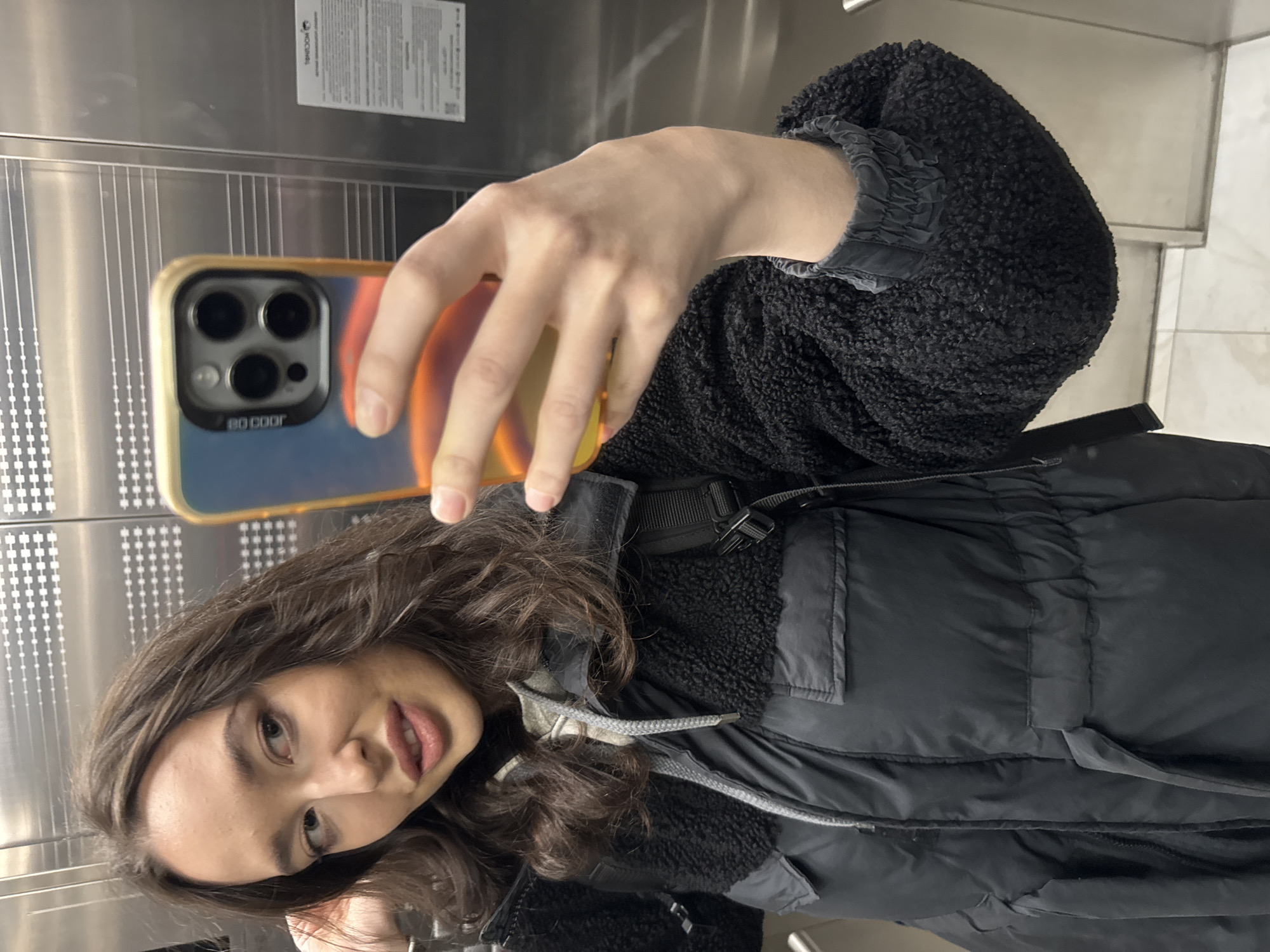 Woman takes selfies in elevator in Khimki, Russia
