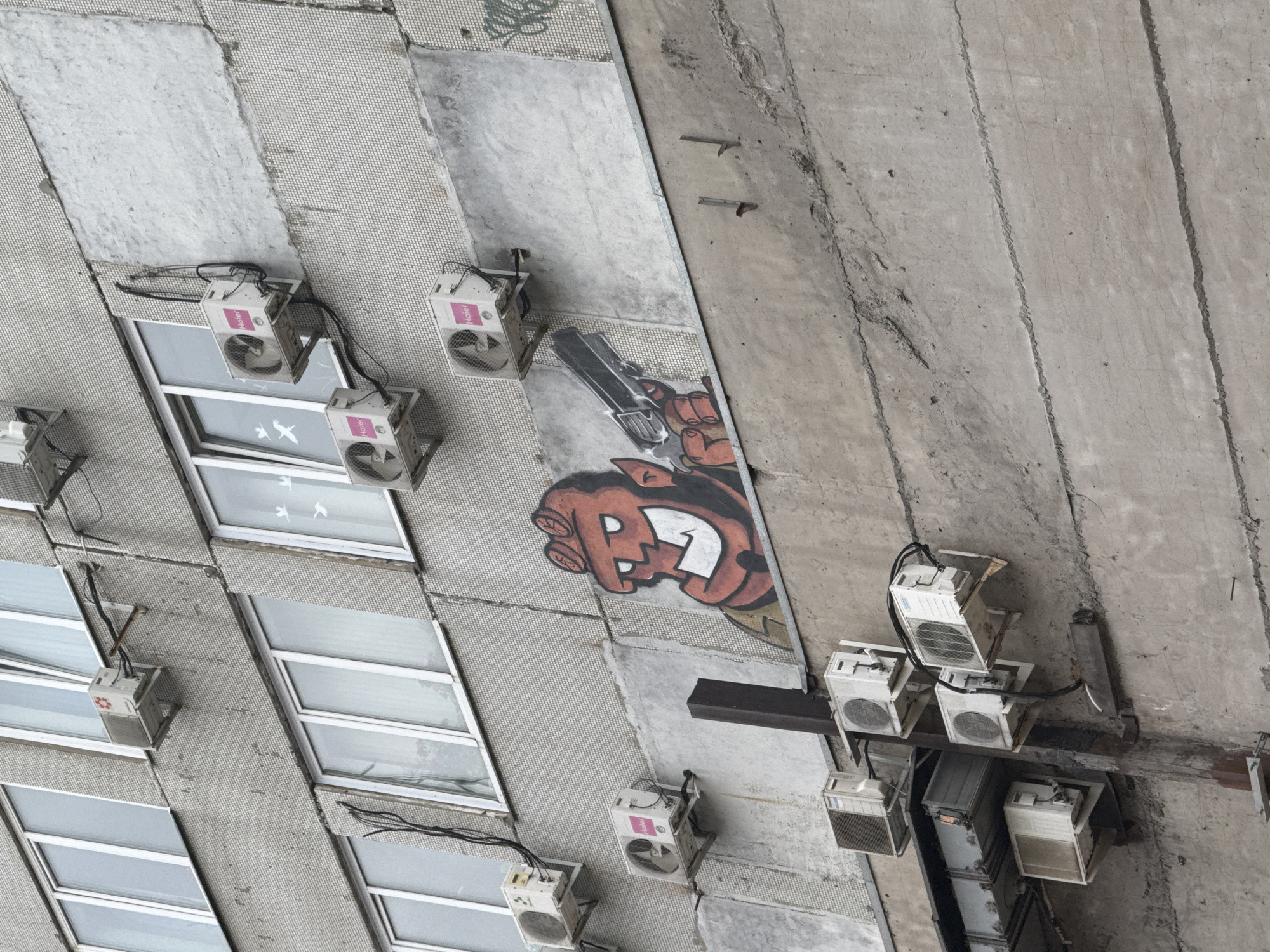 Building facade with gray tile mosaic documented in Krasnoyarsk