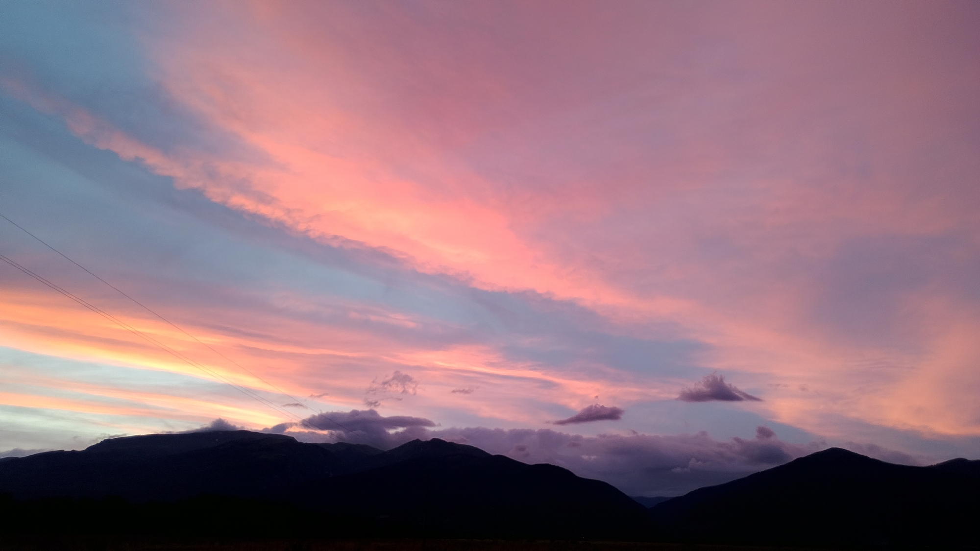 Colorful sunset observed over mountain range in Bulgarian village