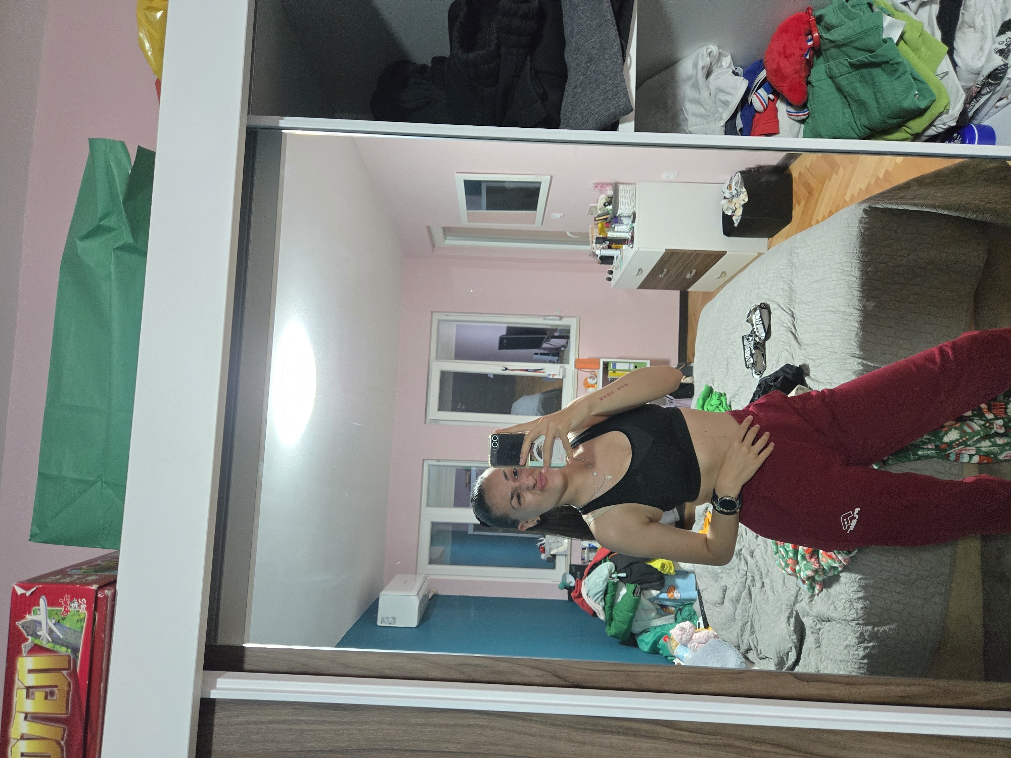 Woman documents bedroom selfie session in Pleven, Bulgaria