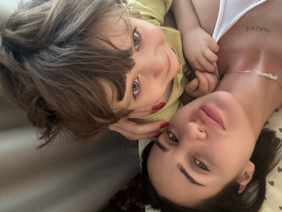 Woman and child photographed in home interior setting