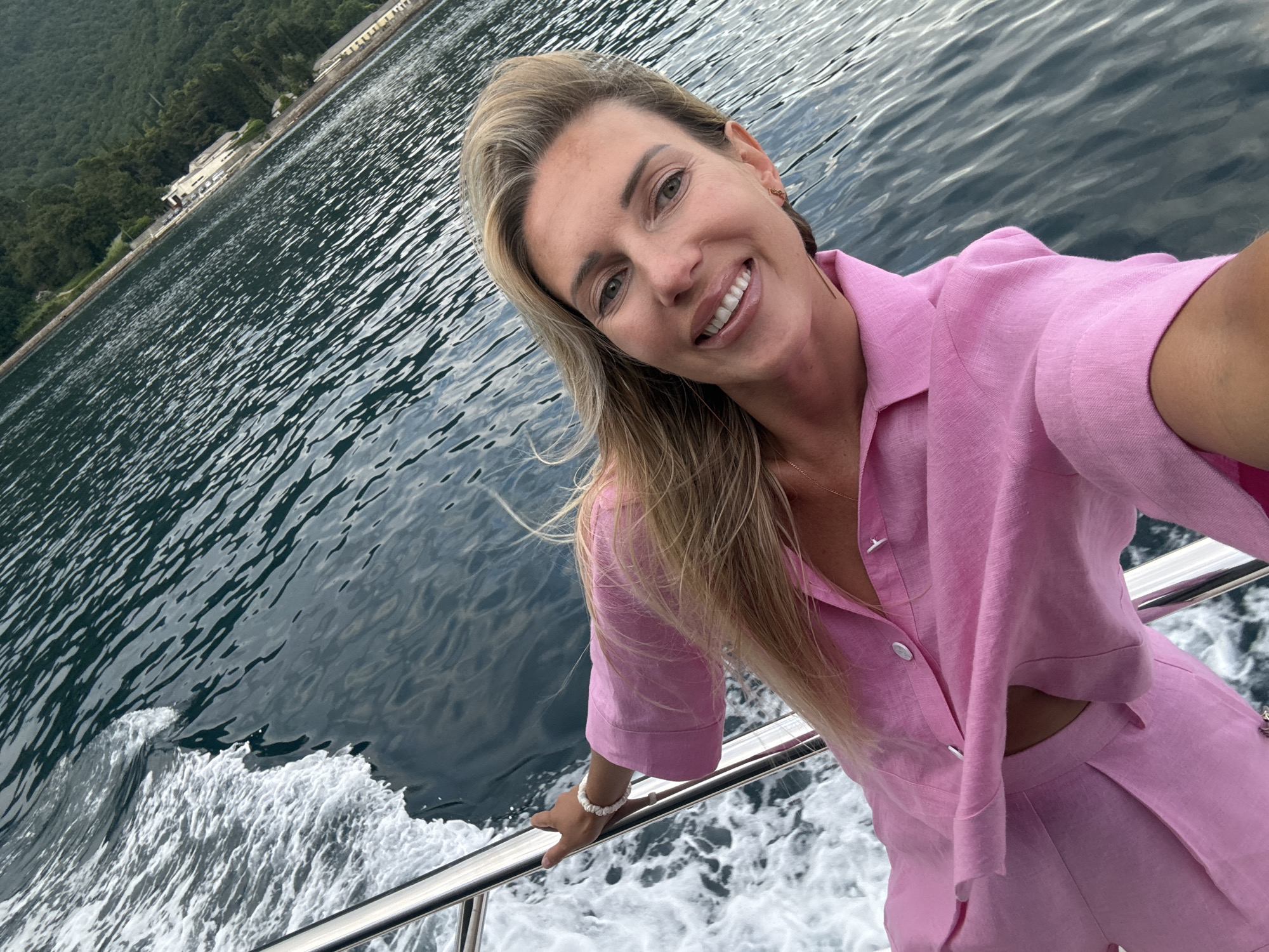 Boat journey documented along Montenegro coast with selfie, wake views