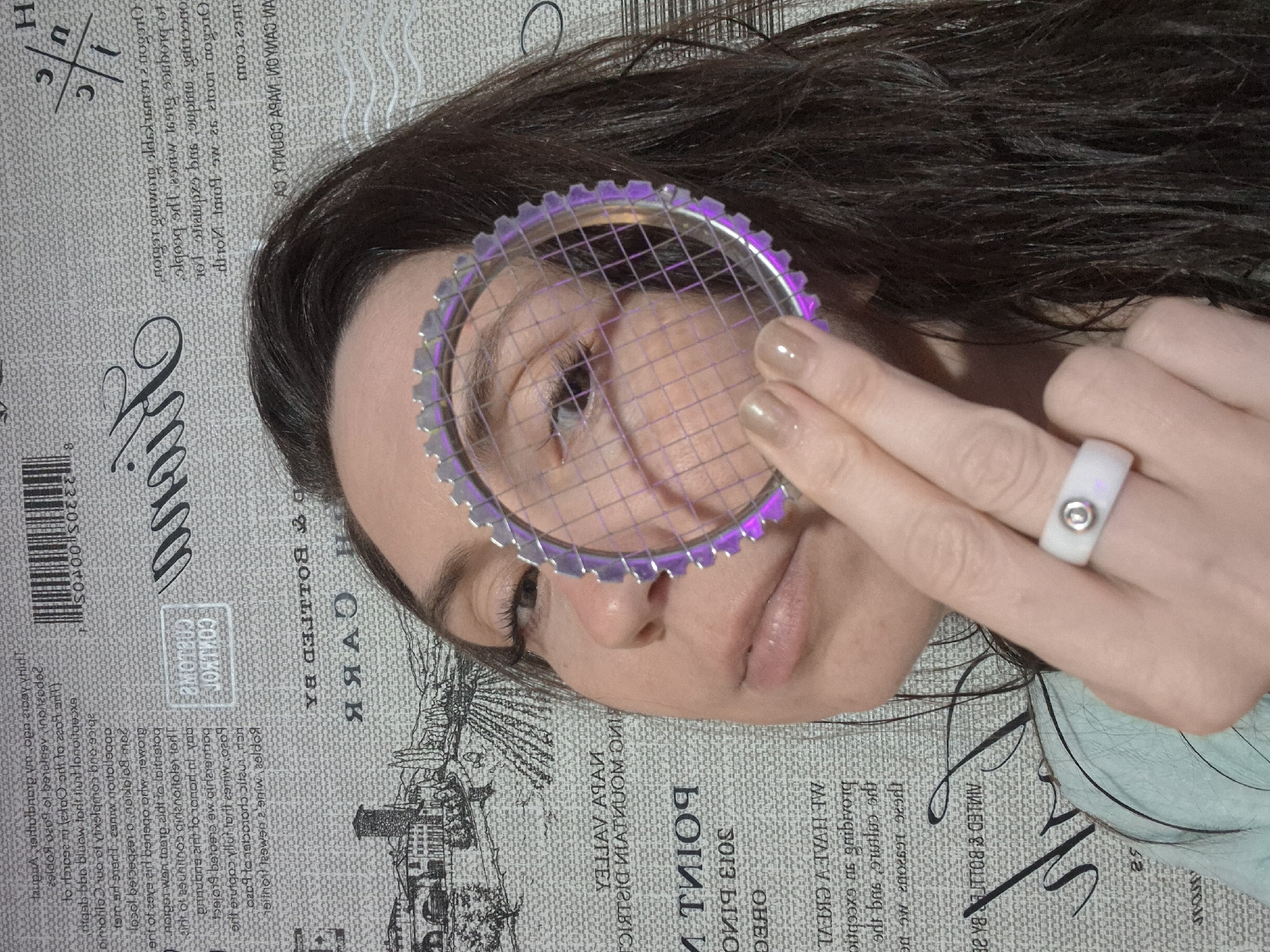 Person experiments with objects covering face in artistic photos