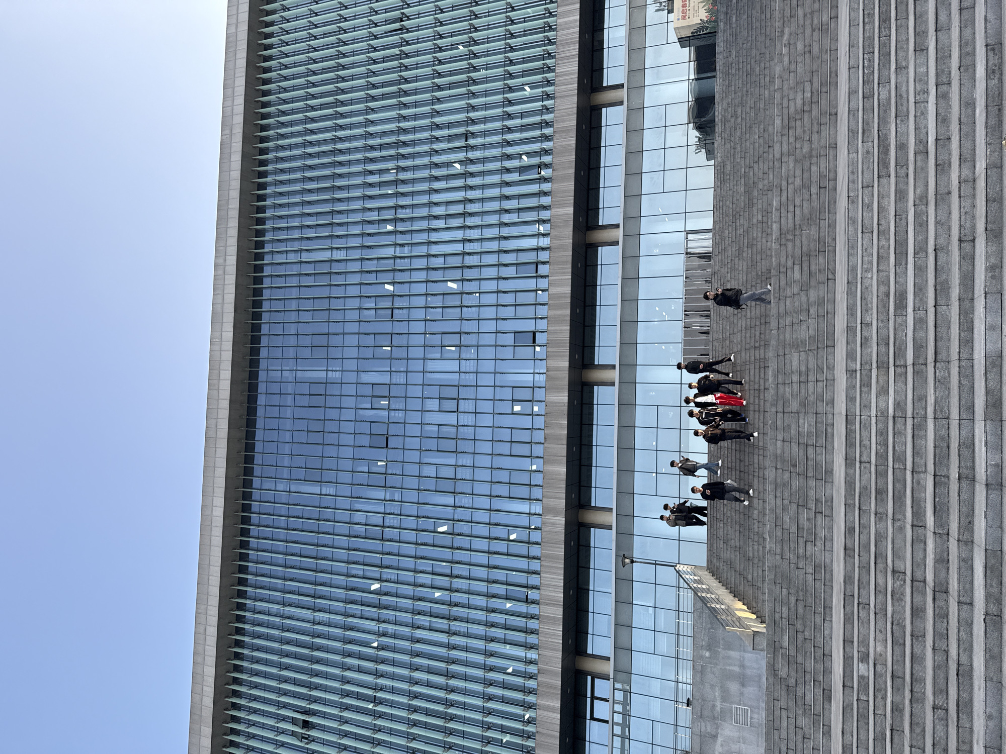 Morning street life documented around modern Jiangjin buildings
