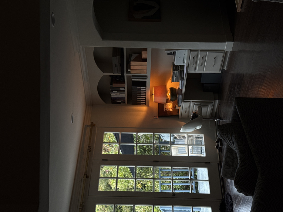 Interior room with built-in bookcase and desk documented in Los Angeles