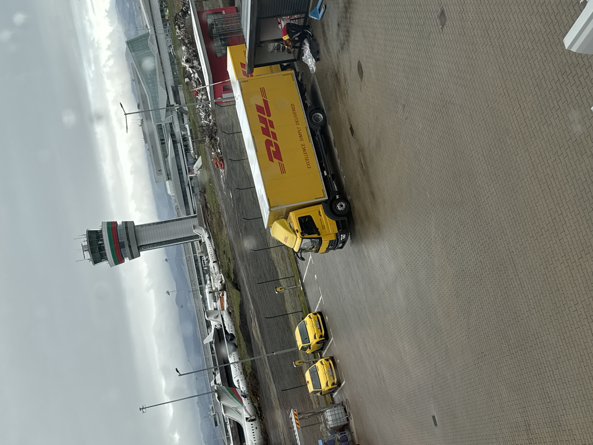 Normal airport operations observed at Sofia with planes, delivery truck