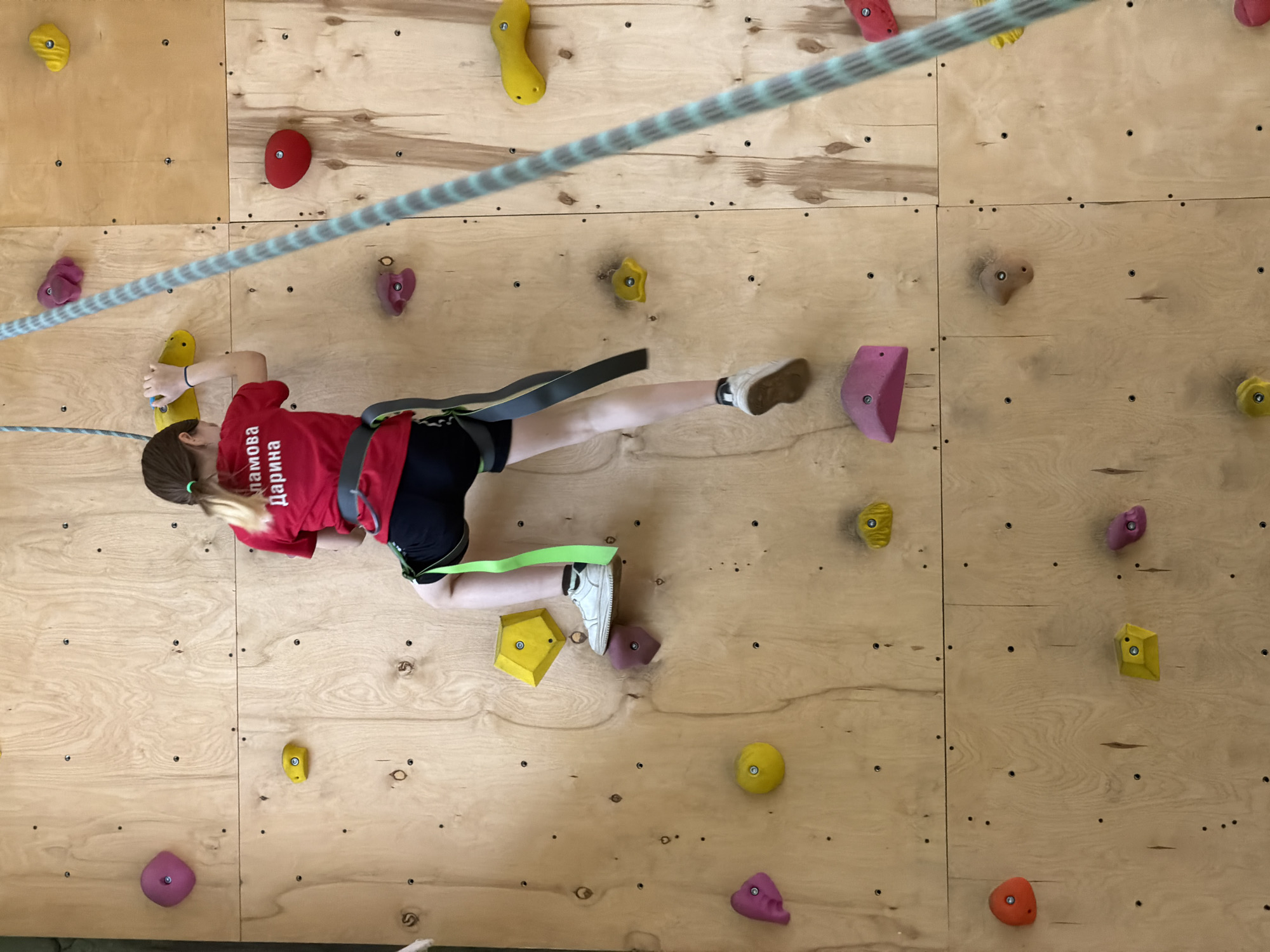 Children's indoor rock climbing session documented in Izhevsk, Russia