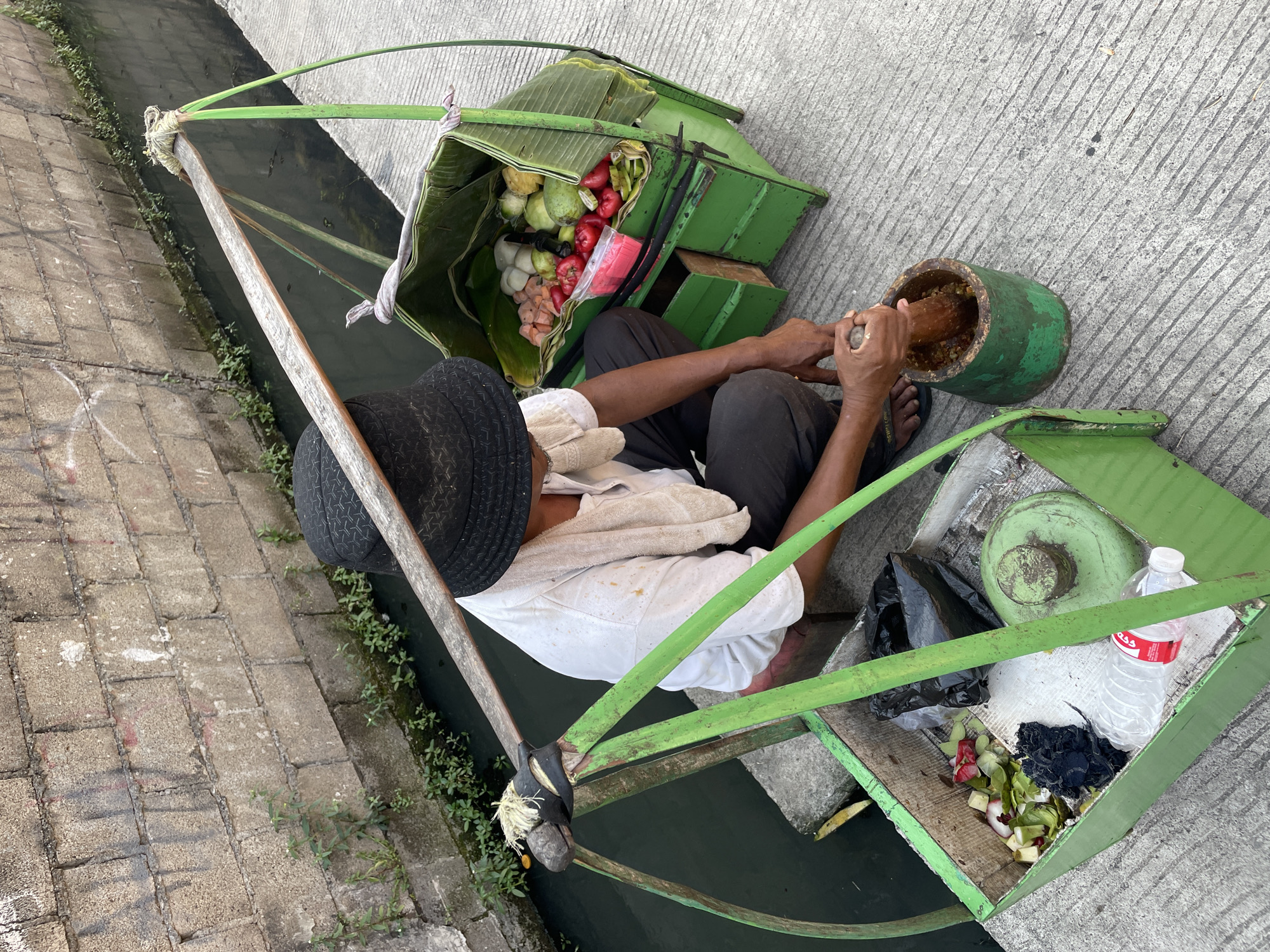 Street food vendor operates in North Jakarta morning scene