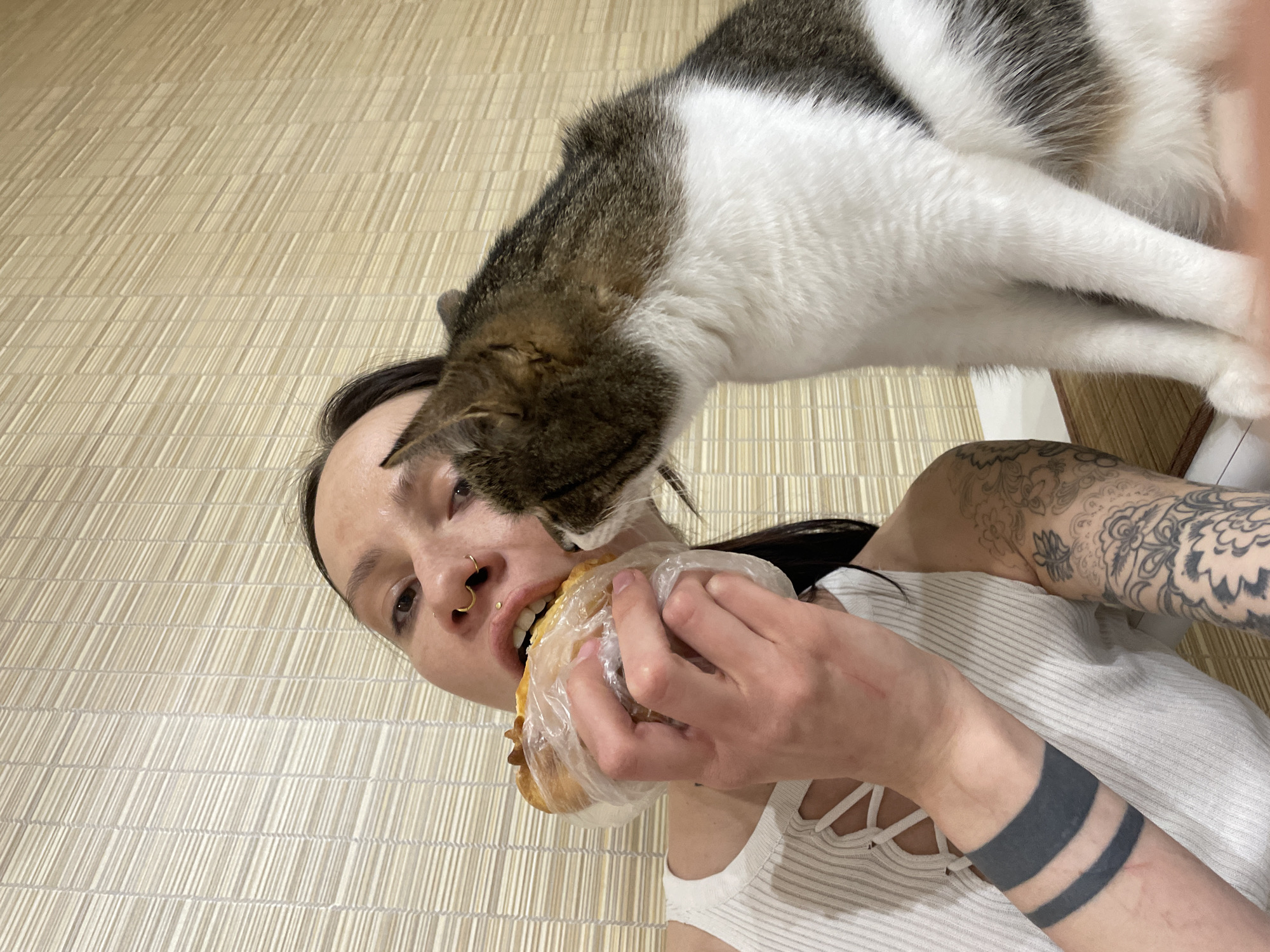 Person eats wrapped sandwich in Izhevsk