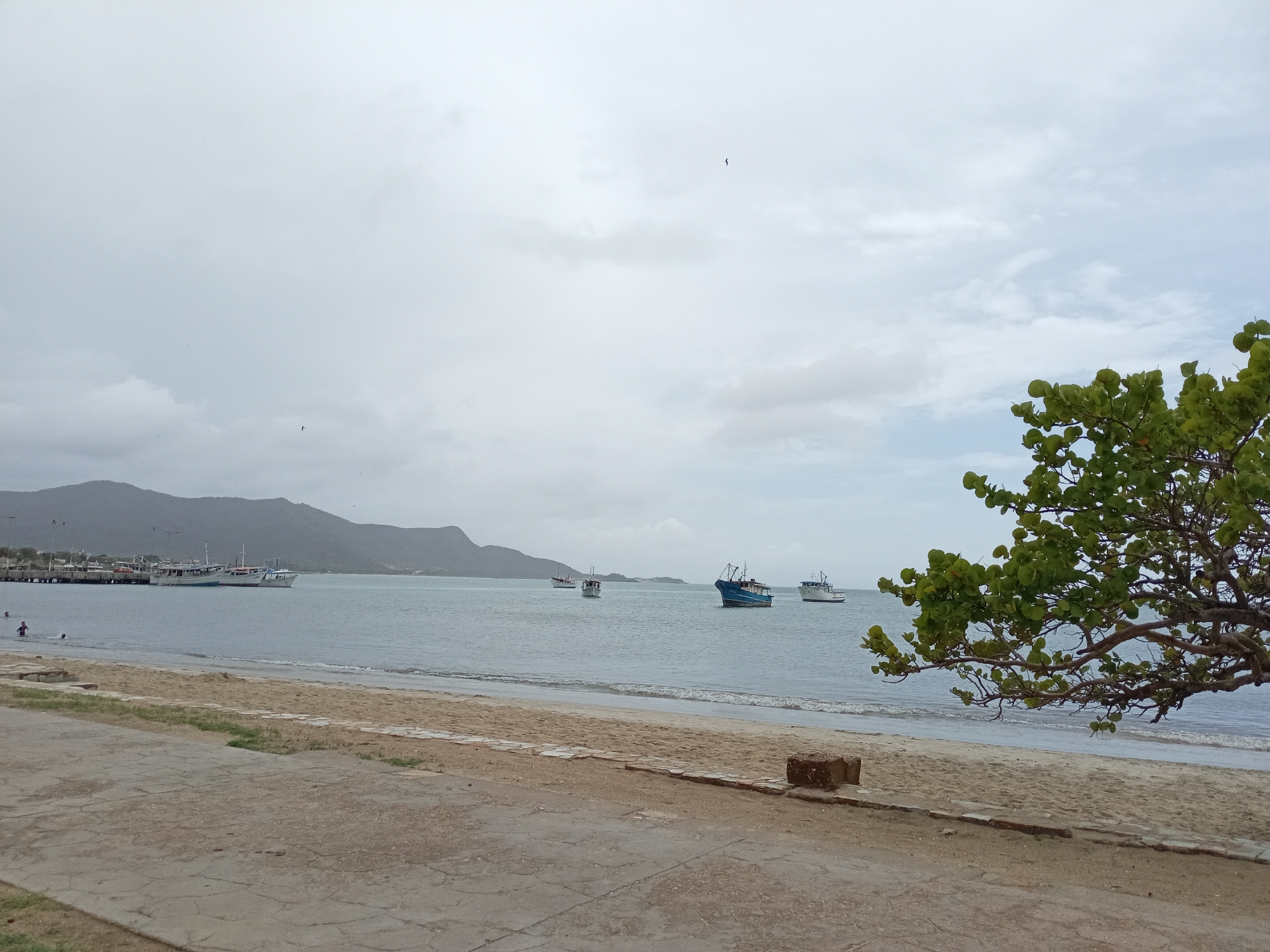 Juan Griego's overcast waterfront, boats, and bay views