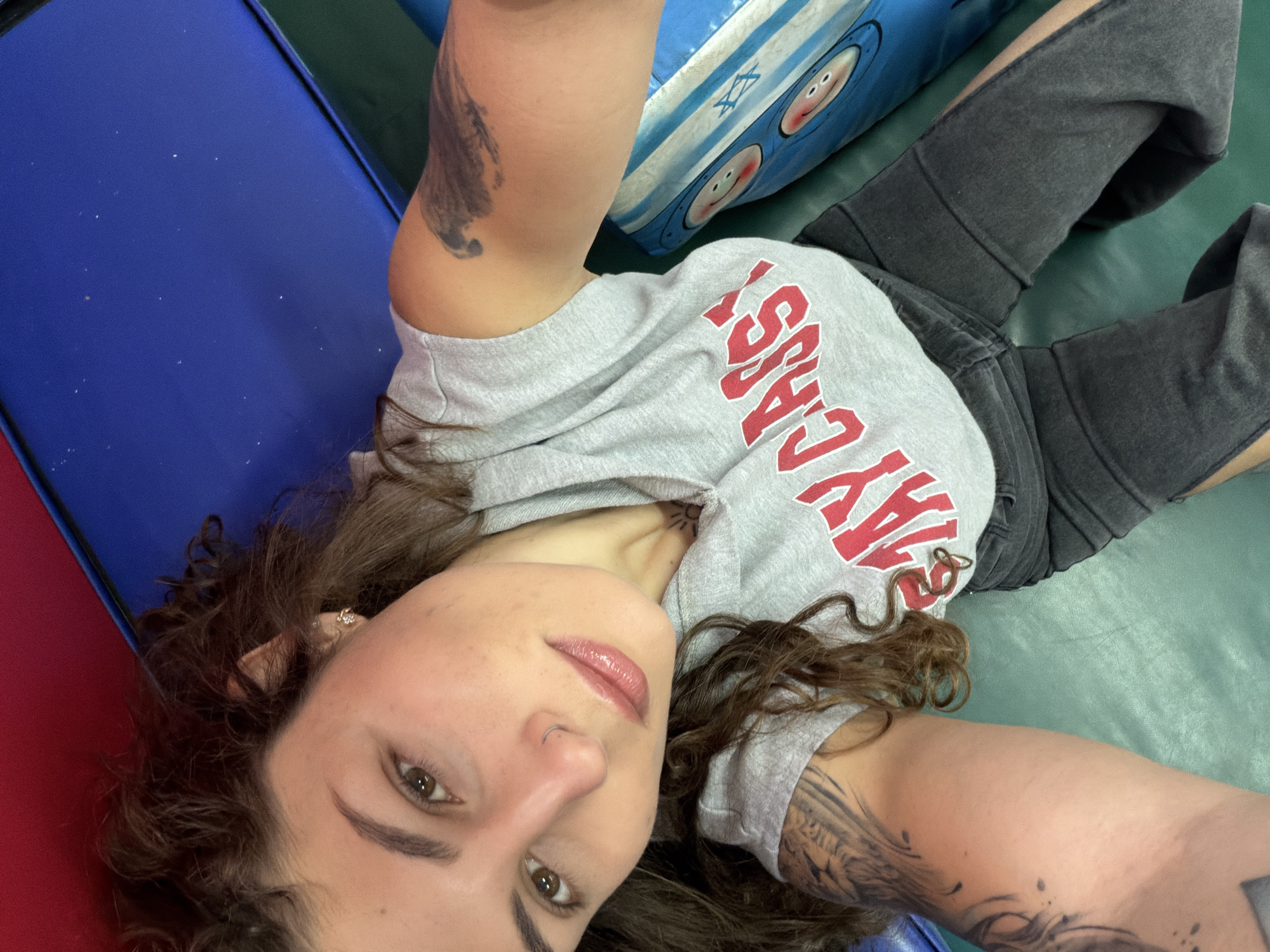 Woman takes selfie while lying down in Kiryat Bialik