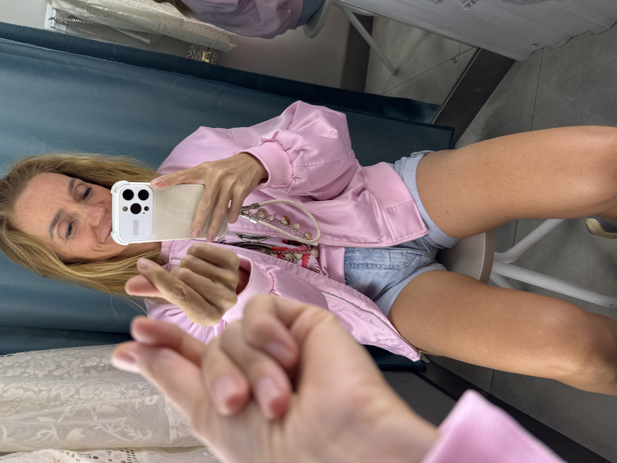 Woman Takes Selfies While Trying On Clothes in Russian Store