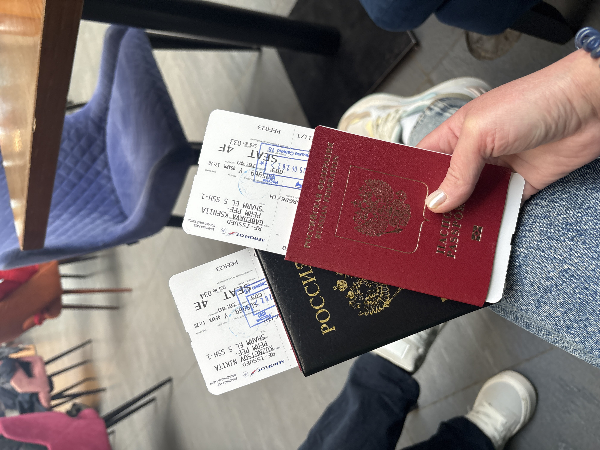 Traveler with dual passports, woman photographed at Bolshoye Savino