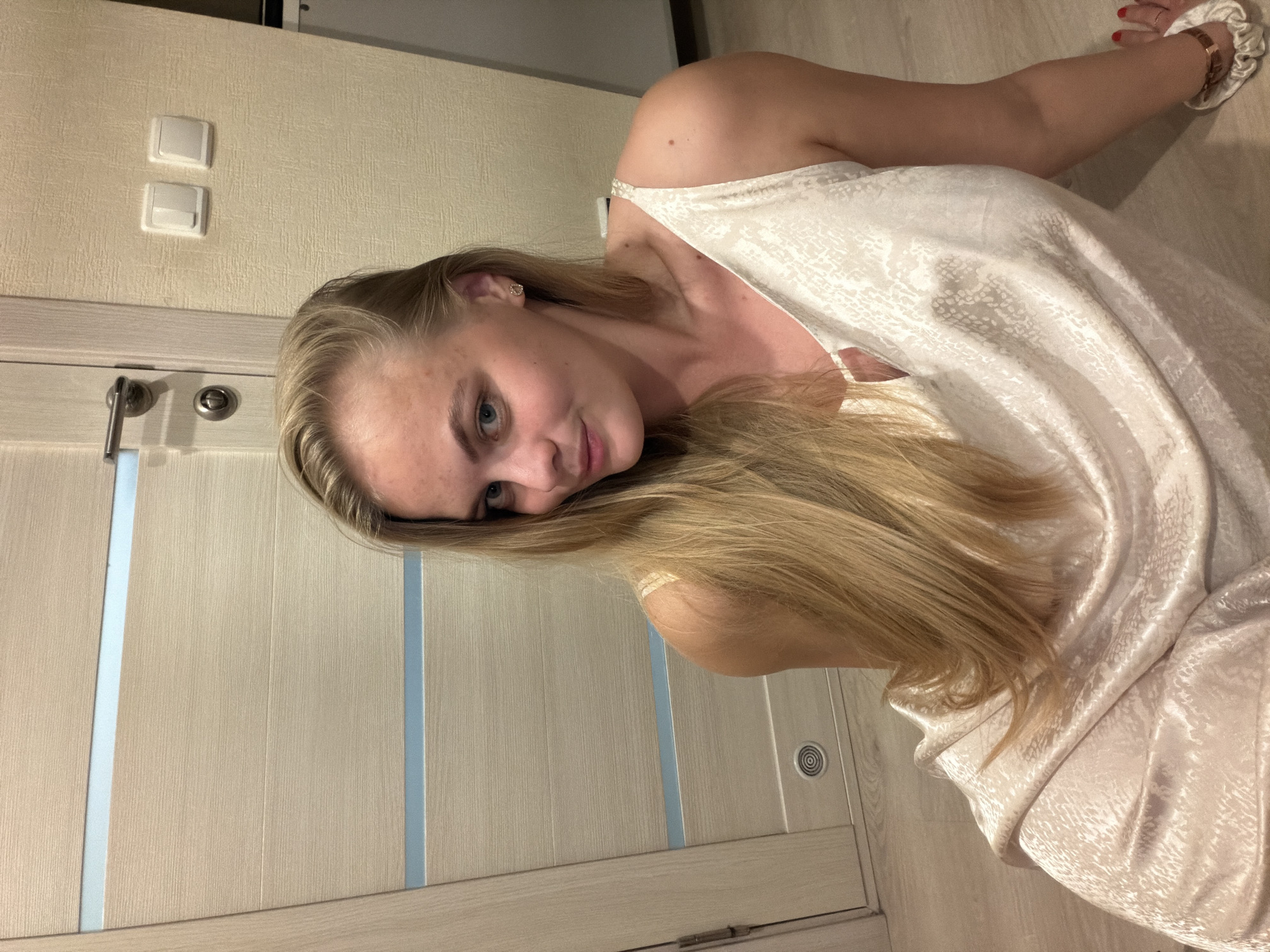 Woman conducts indoor photo session in Izhevsk apartment