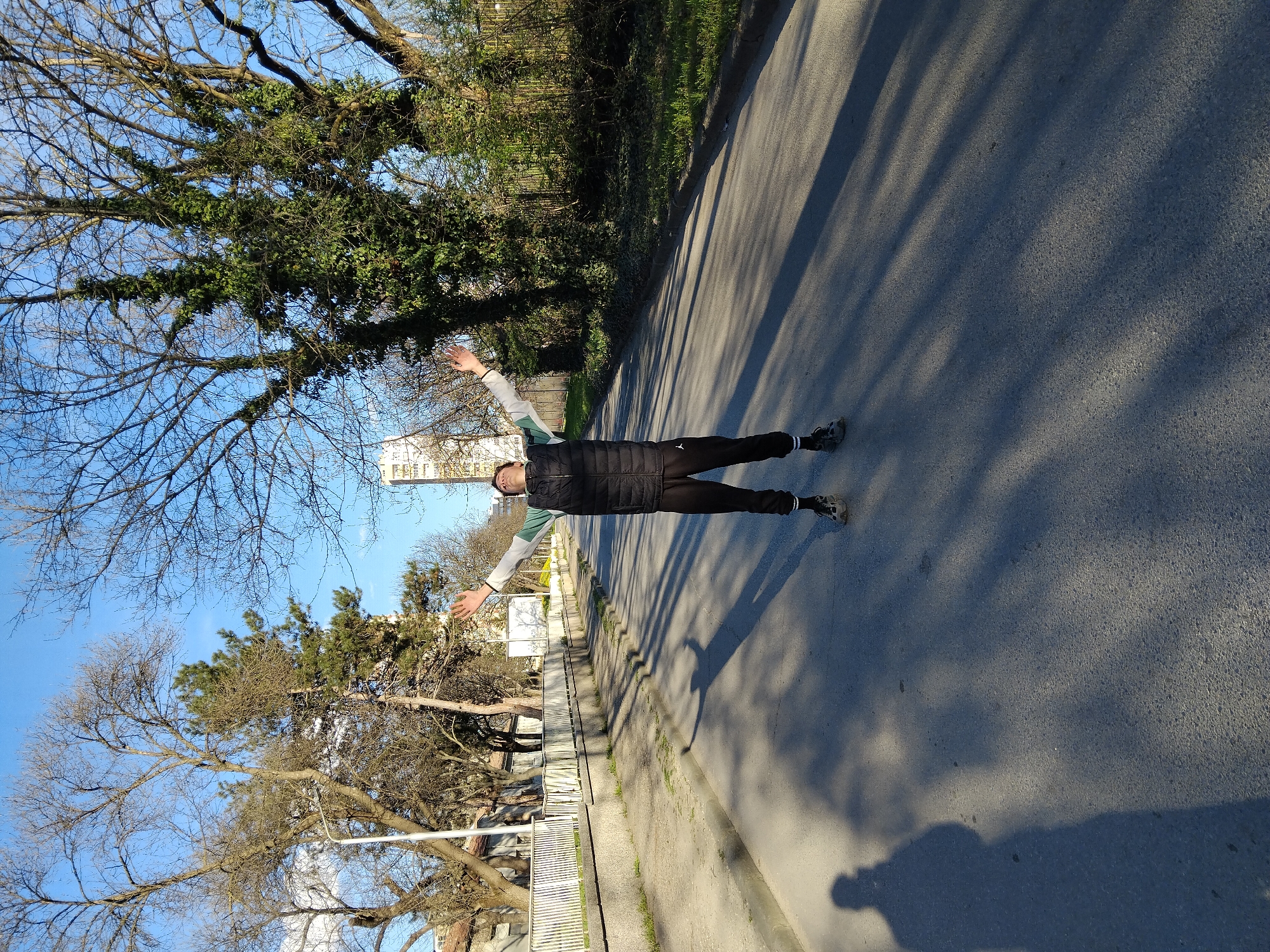 Man stands with outstretched arms on Kazanlak road