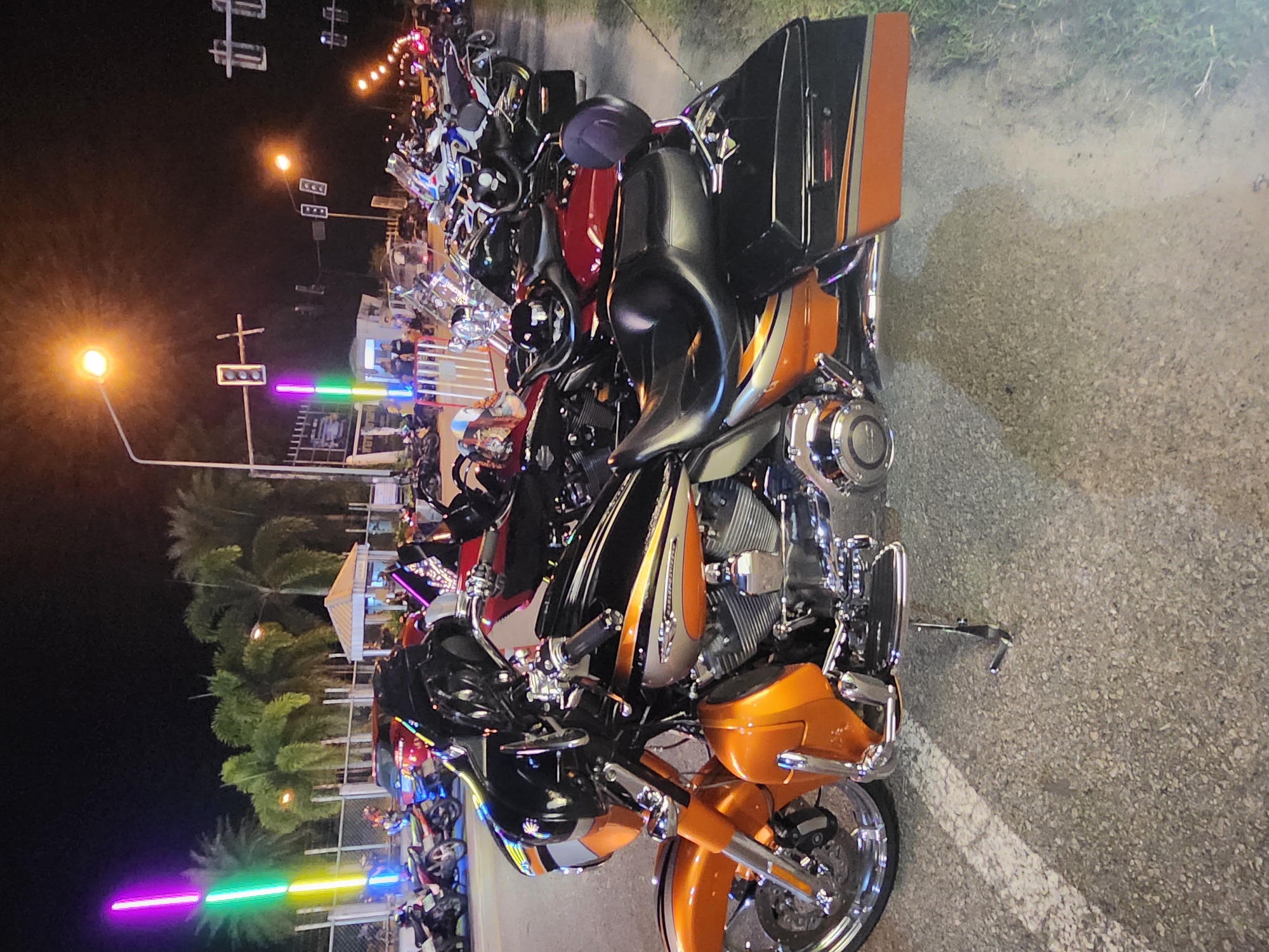 Evening street life in Trang: bikes, bugs, and a live stage