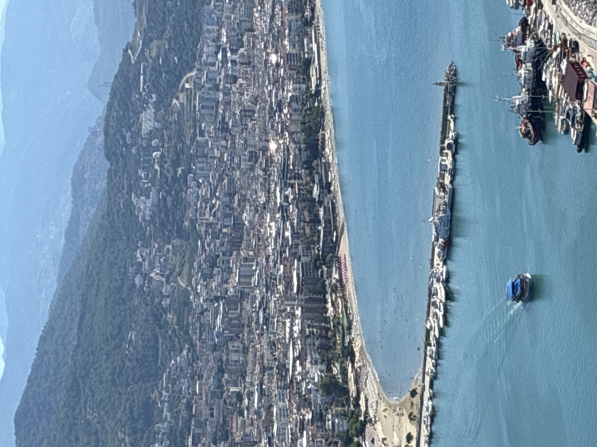 Alanya from above: castle ruins, harbor, and coastline on a summer morning